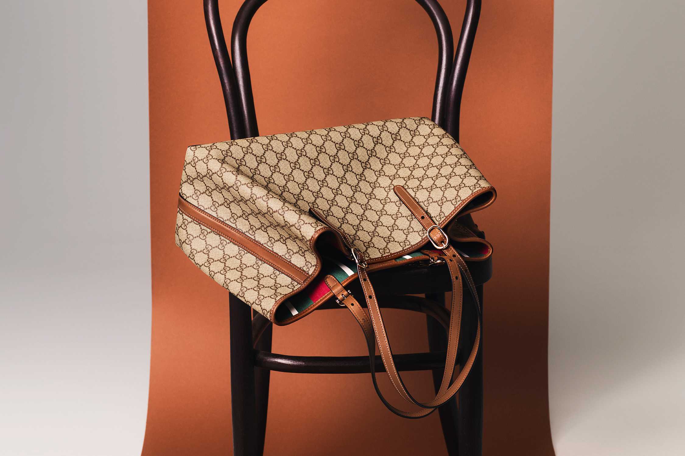 Beige Gucci monogram handbag displayed