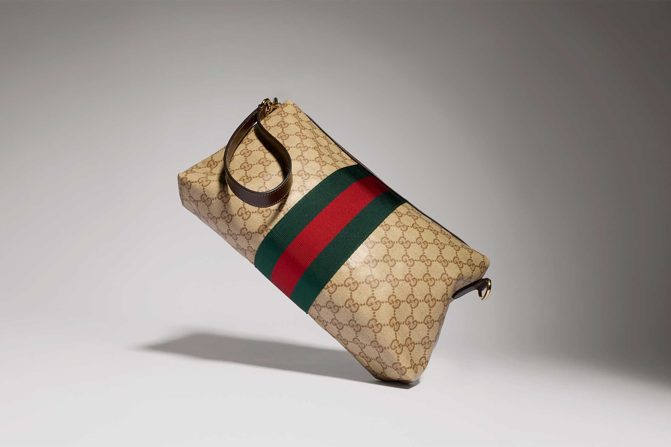 Gucci monogram clutch with stripes