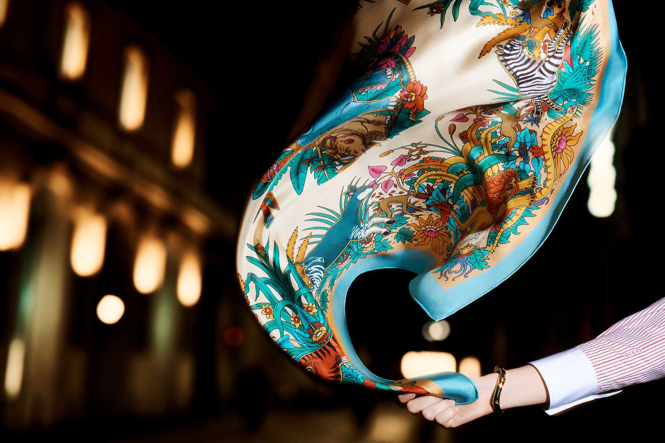 Colourful Gucci silk scarf displayed