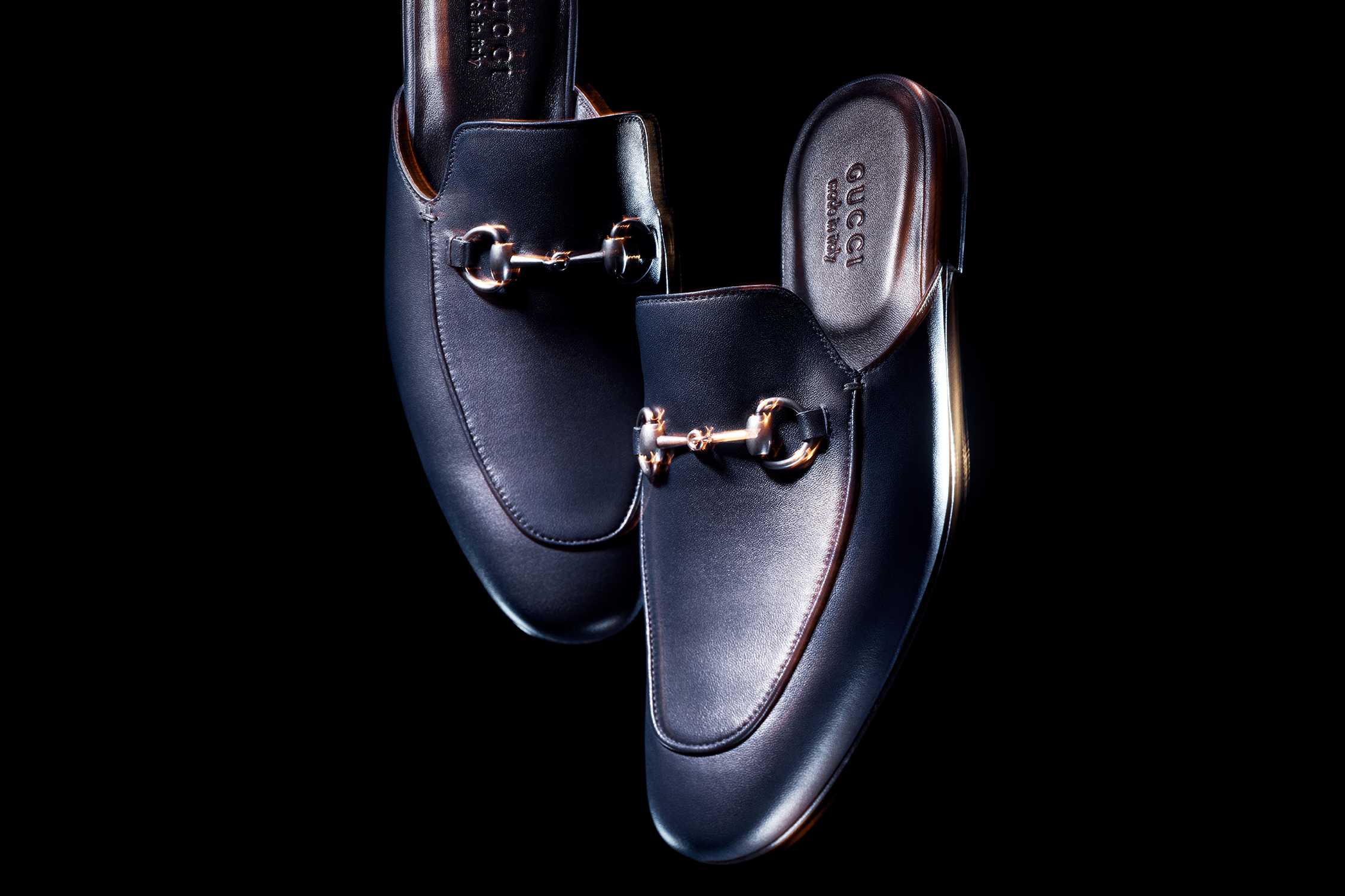 Black Gucci leather horsebit loafers