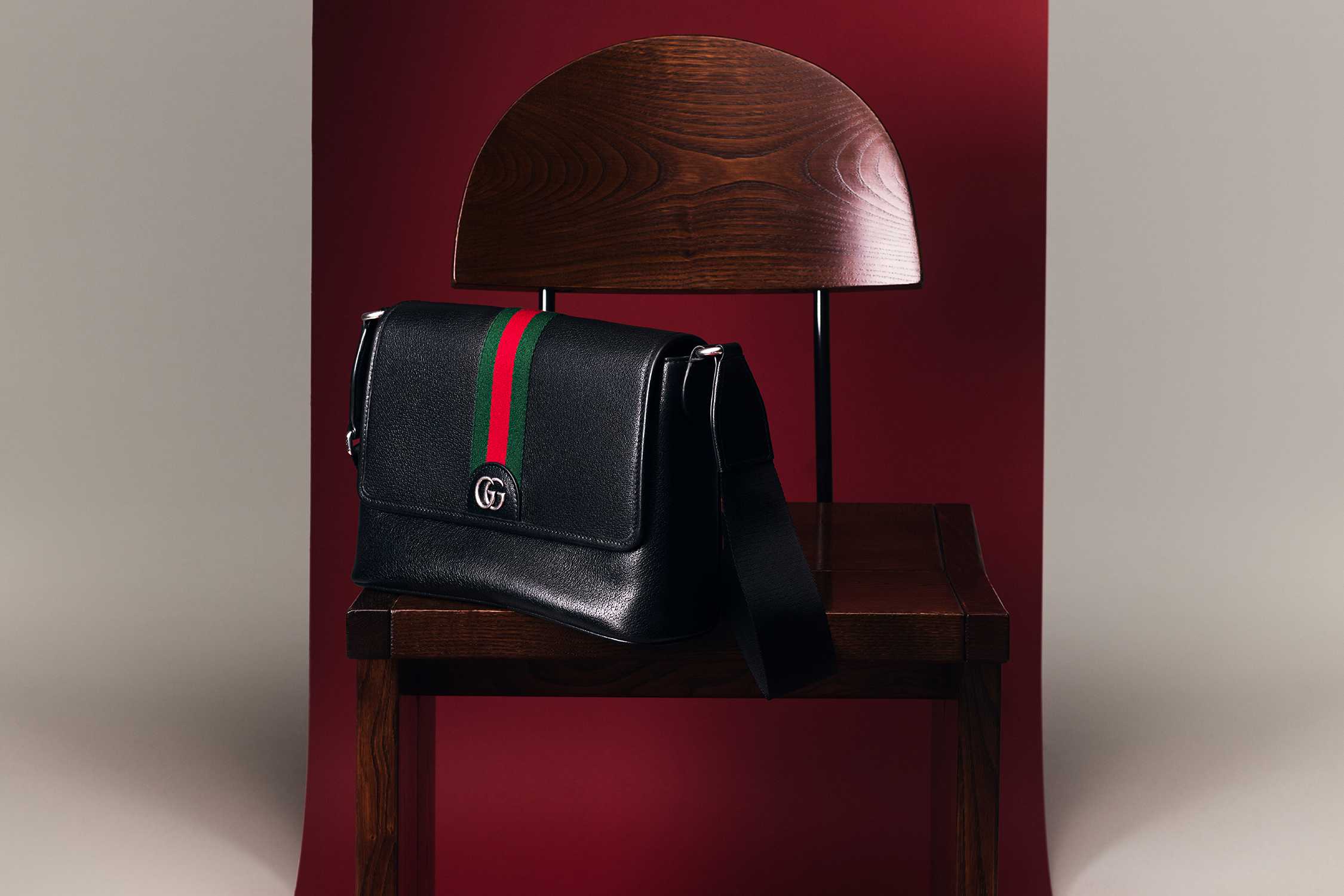 Black Gucci bag with striped detail.