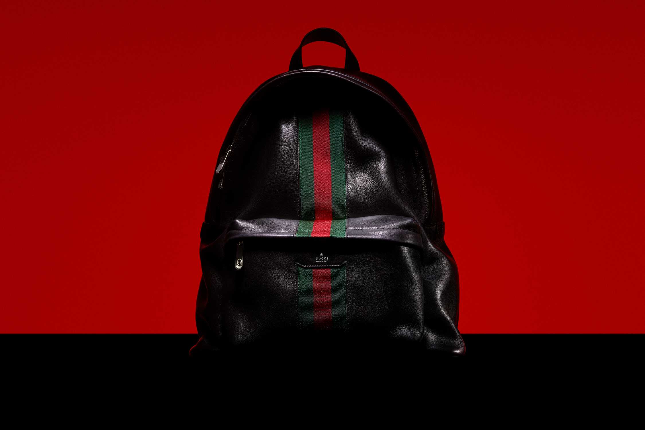 Black Gucci backpack with stripes