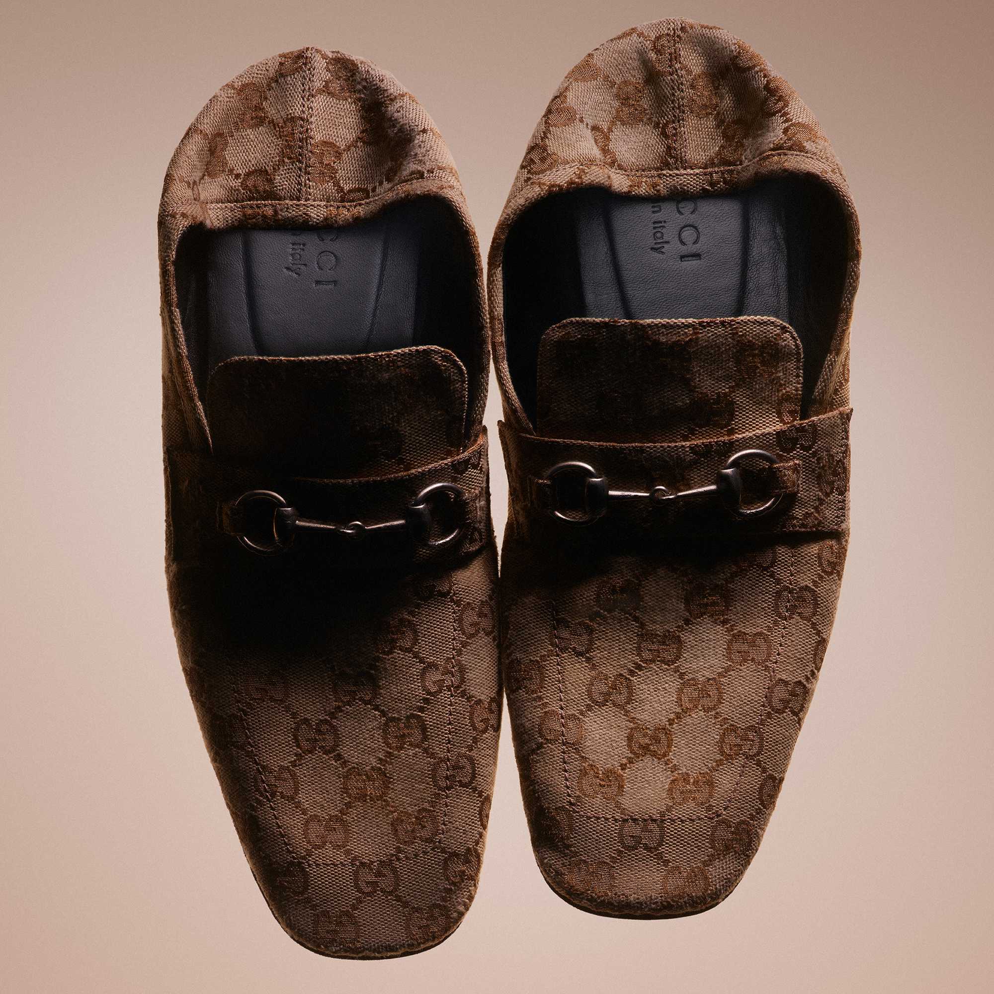 Black Gucci loafers in wardrobe