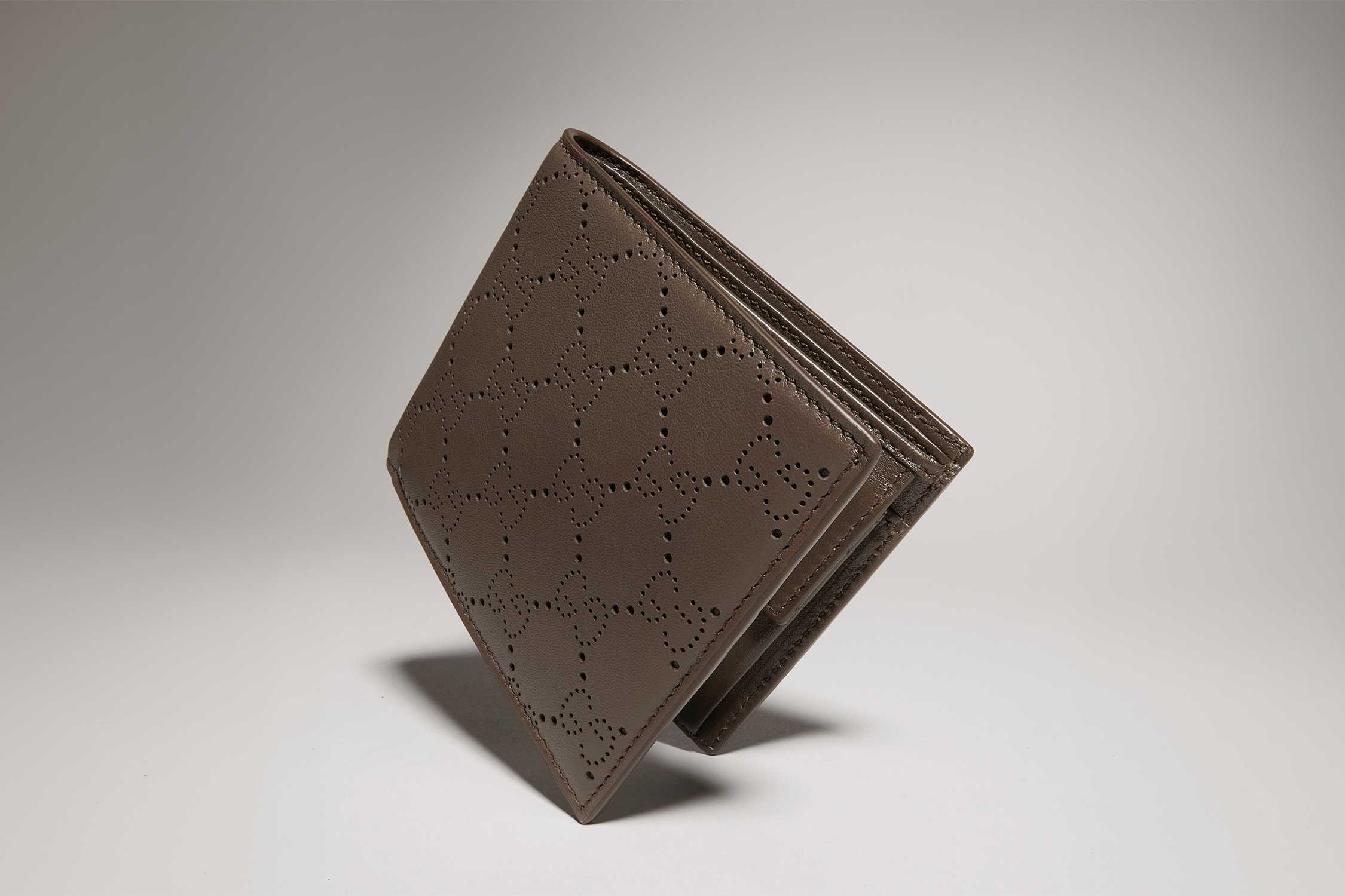 Brown Gucci perforated leather wallet