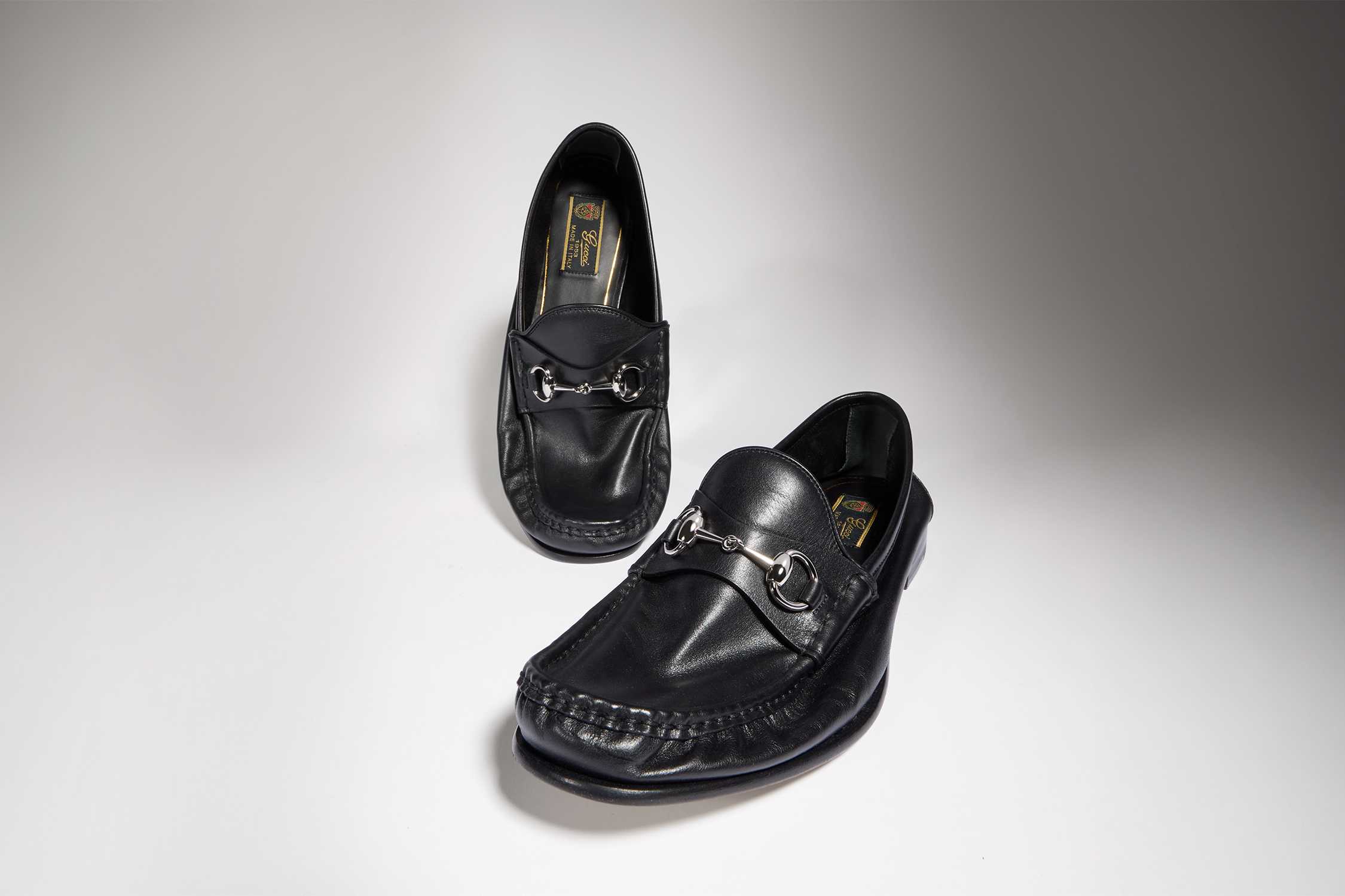 Black Gucci horsebit leather loafers