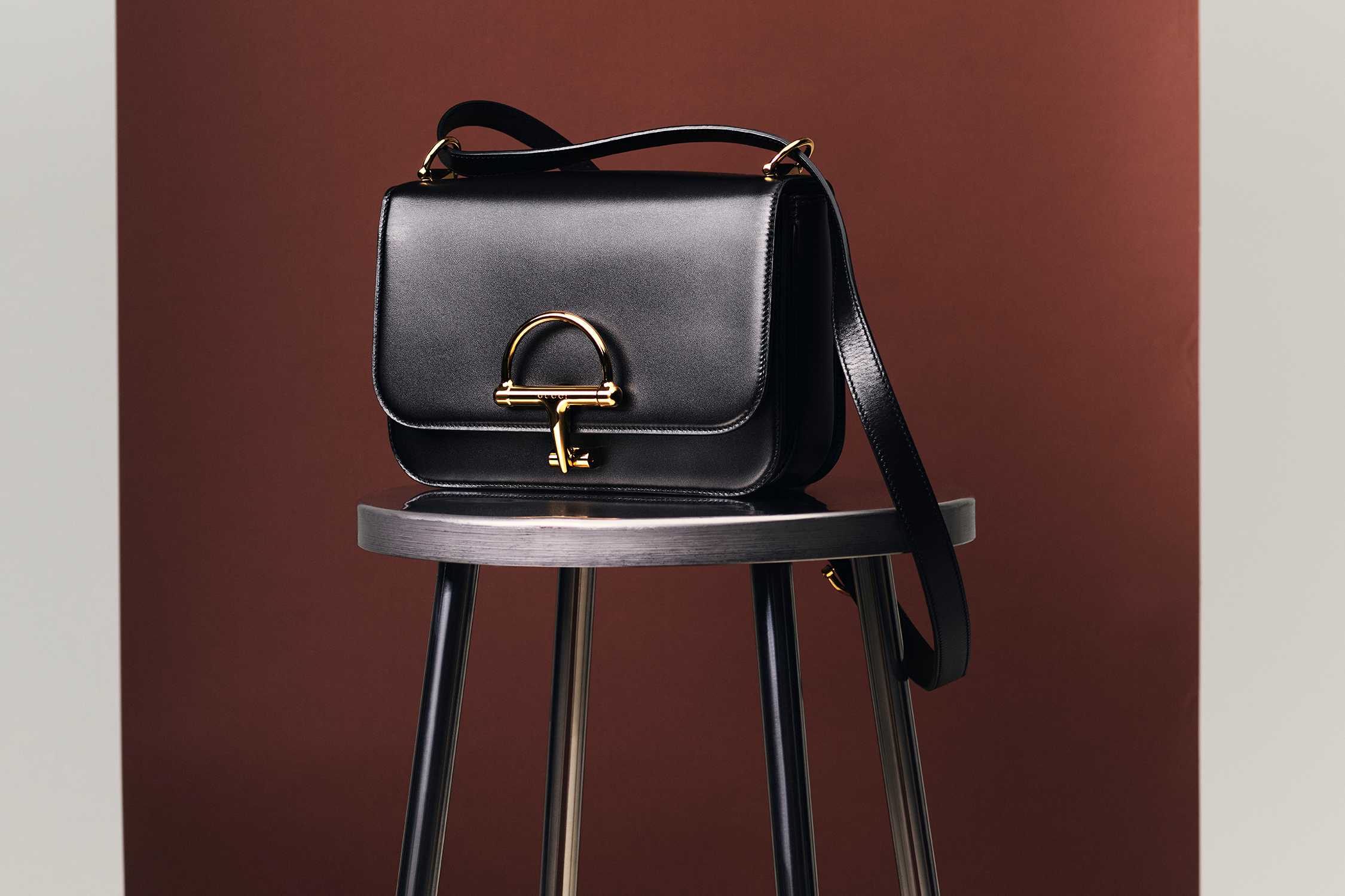 Black Gucci handbag with gold hardware.
