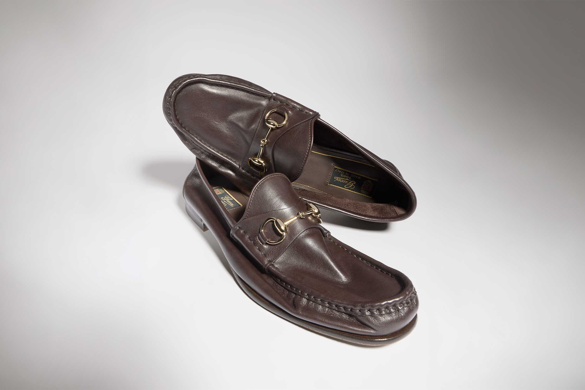 Brown Gucci leather horsebit loafers