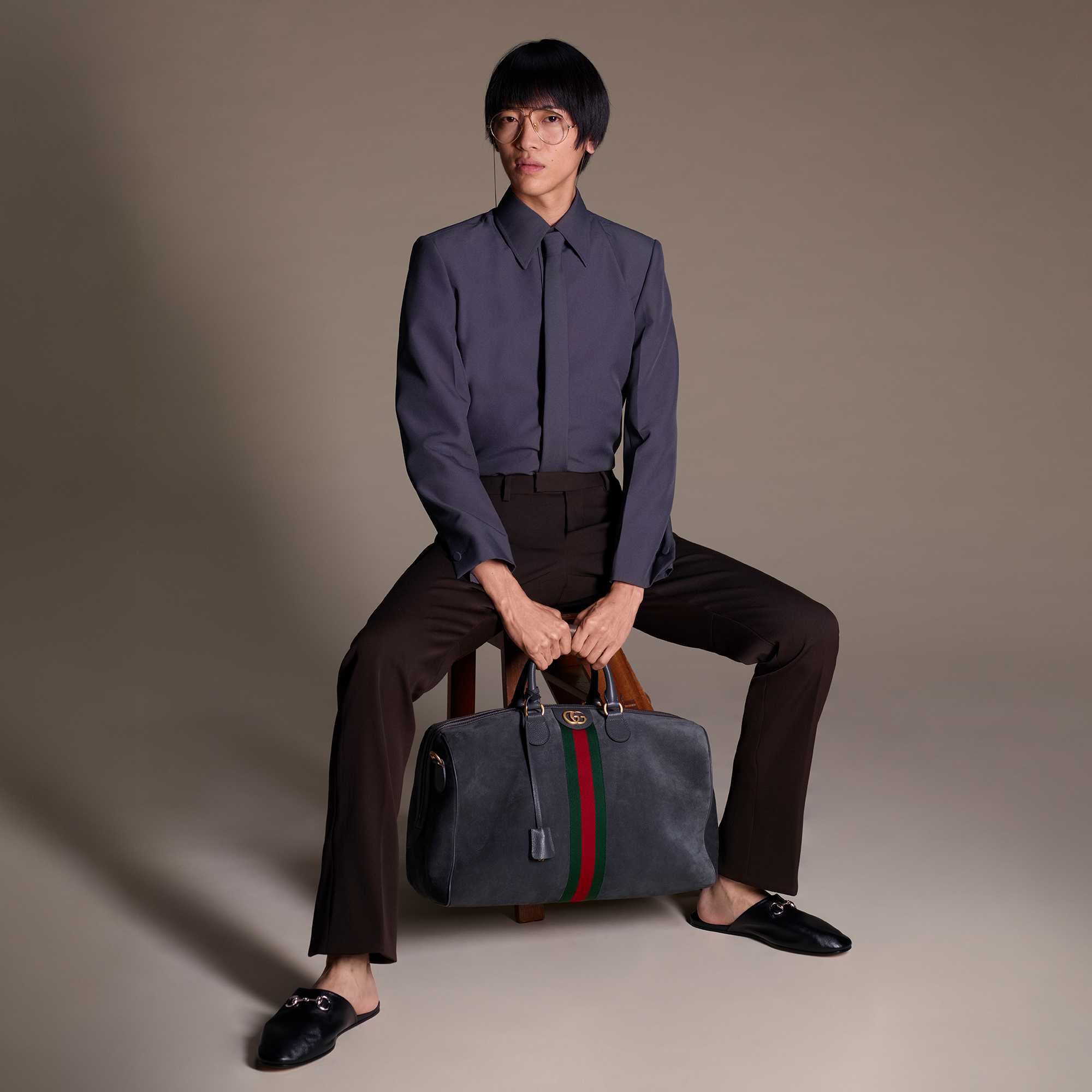 Grey suit with Gucci bag