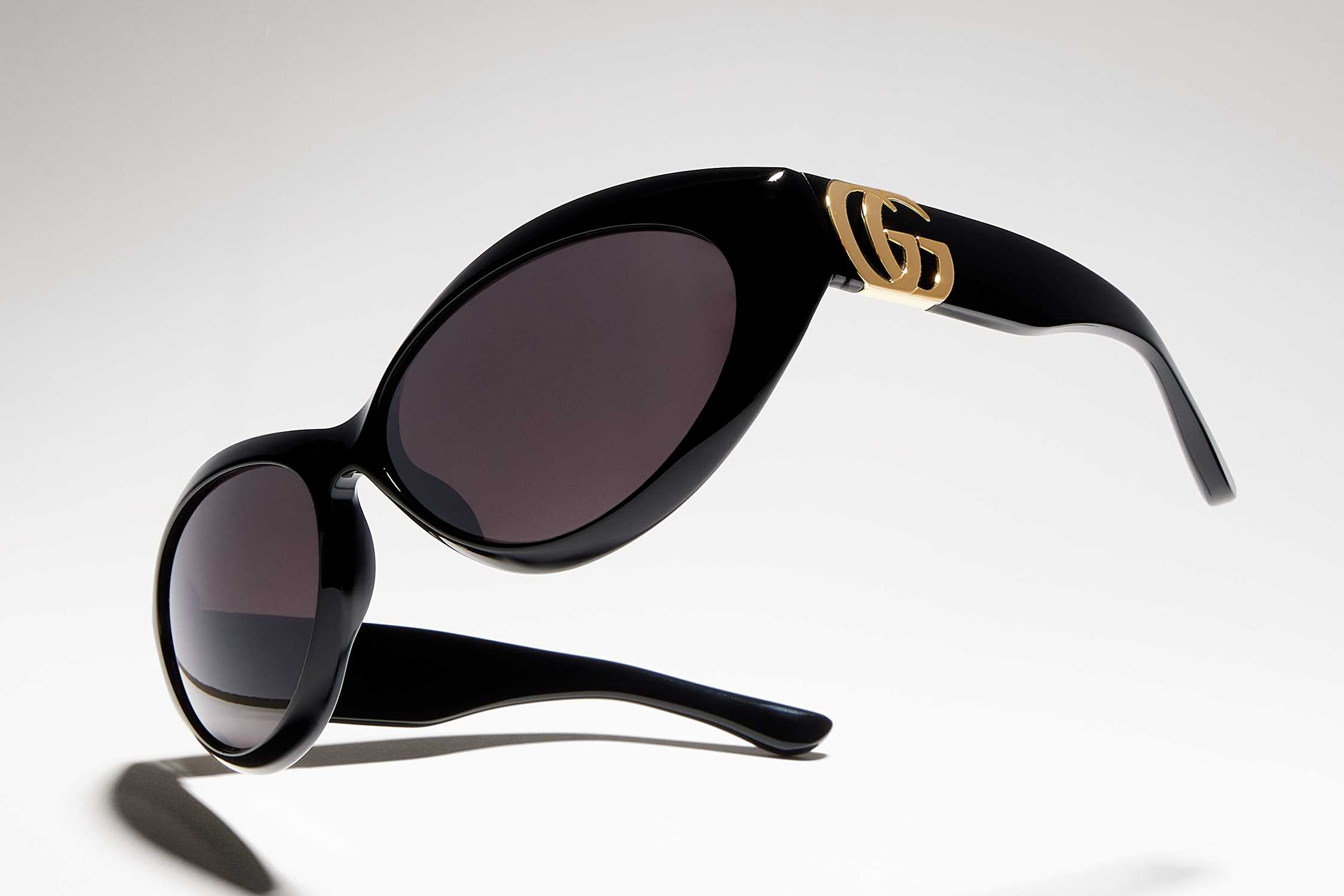 Black Gucci sunglasses gold logo