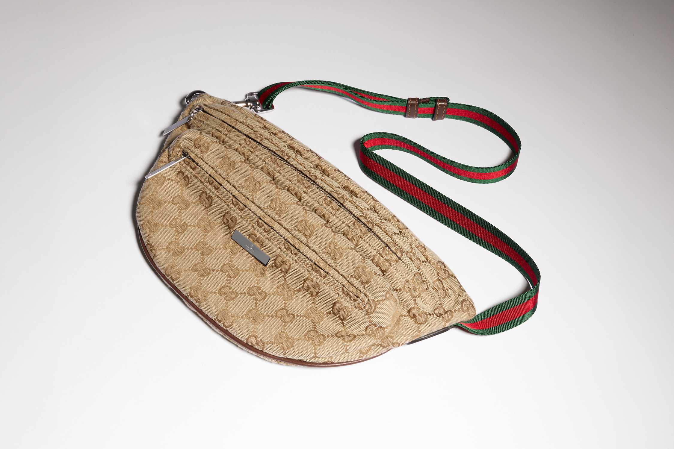 Beige Gucci monogram belt bag