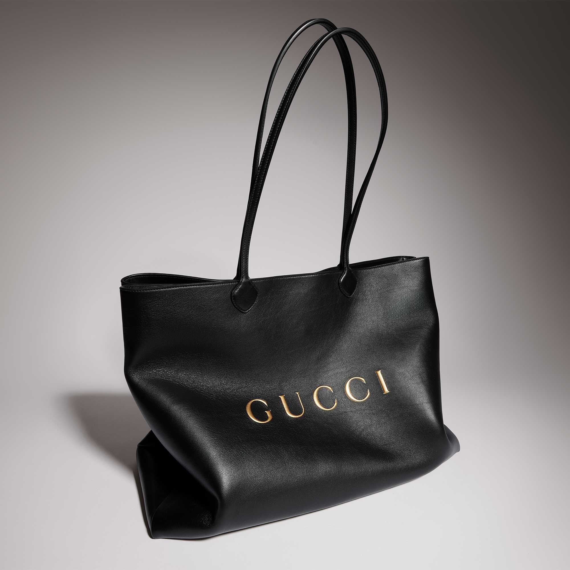 Black leather tote with Gucci logo