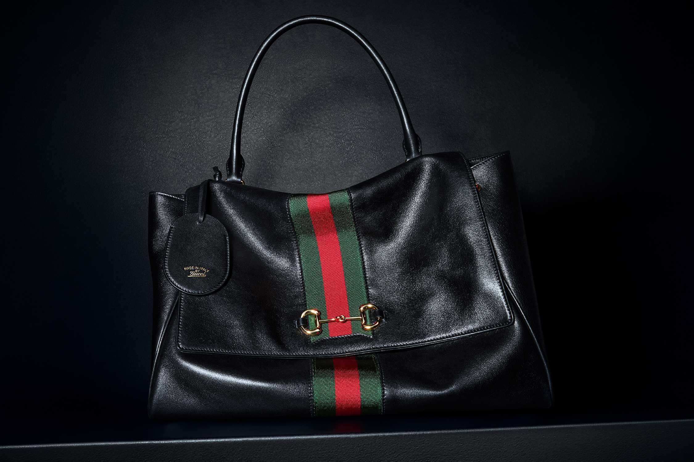 Black Gucci bag with stripes
