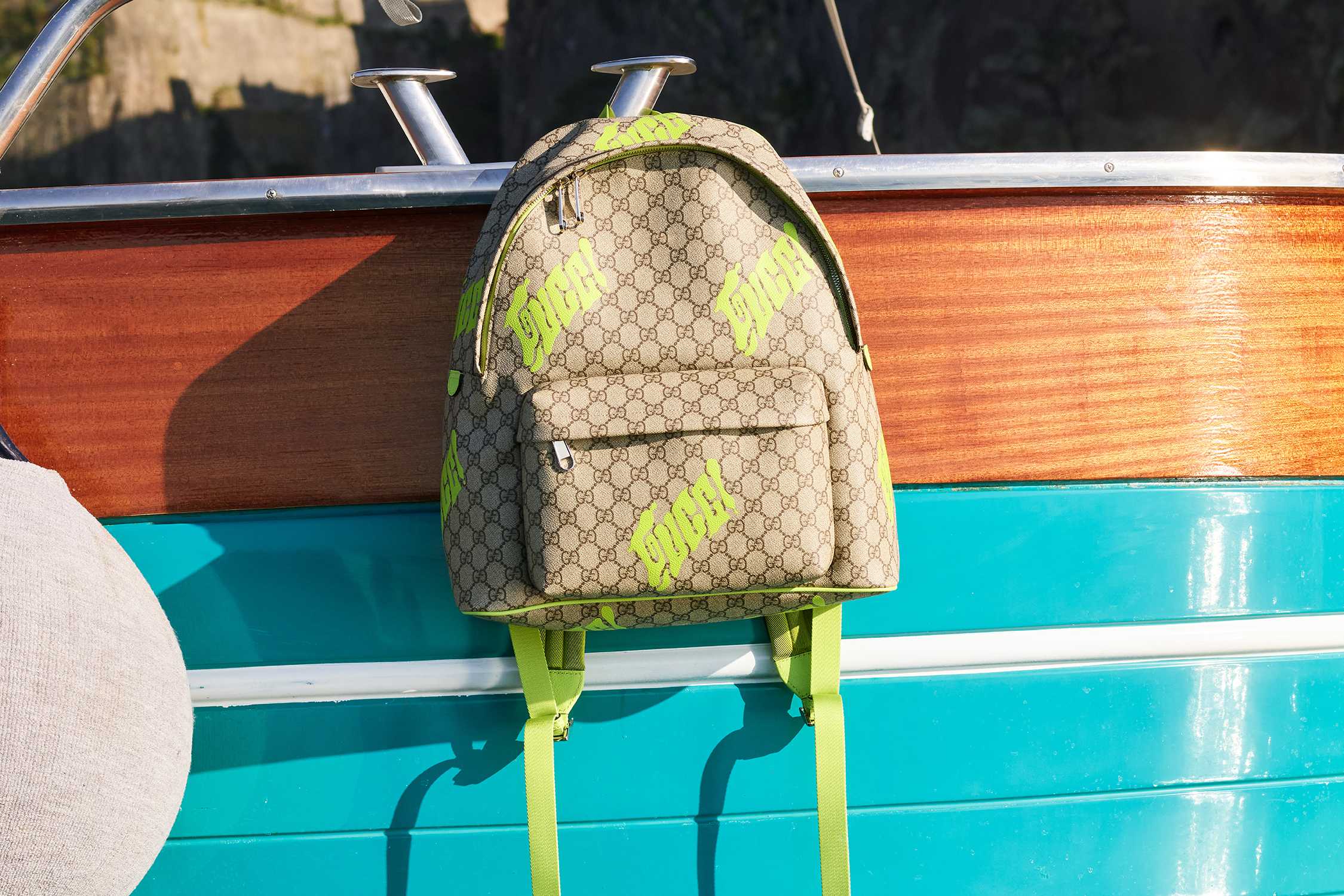 Designer backpack on wooden boat.