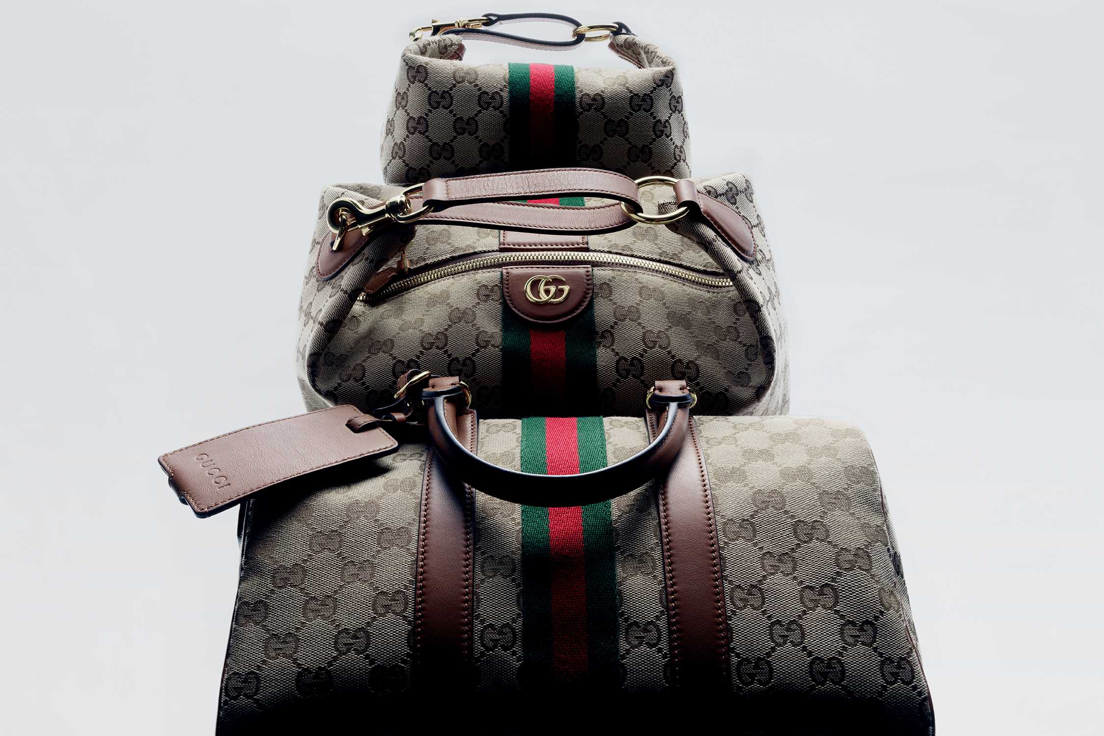 Gucci monogram bags with stripes