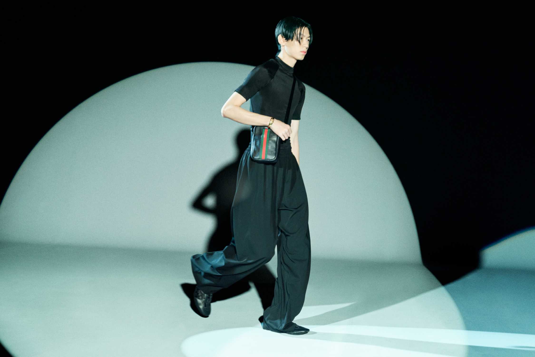 Black Gucci crossbody with stripes