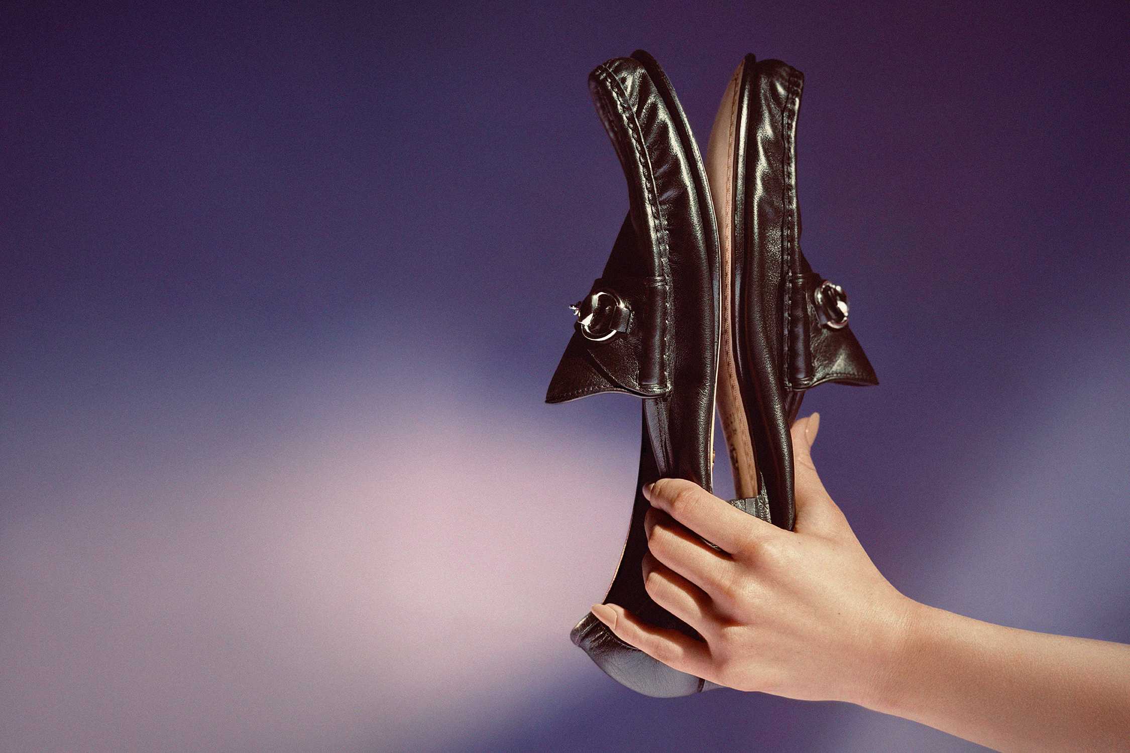 Brown Gucci leather loafers displayed