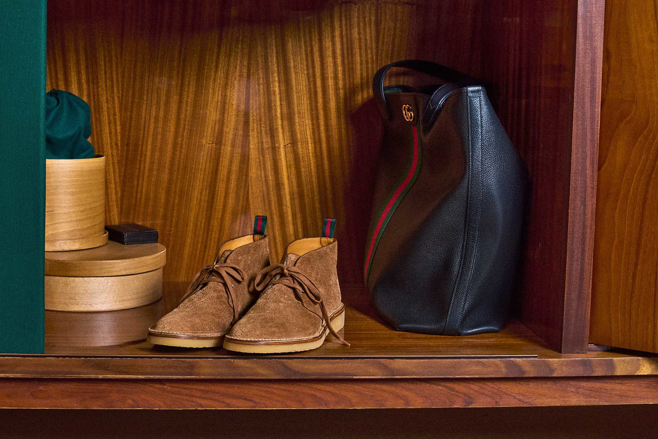 Black Gucci bag, brown shoes.