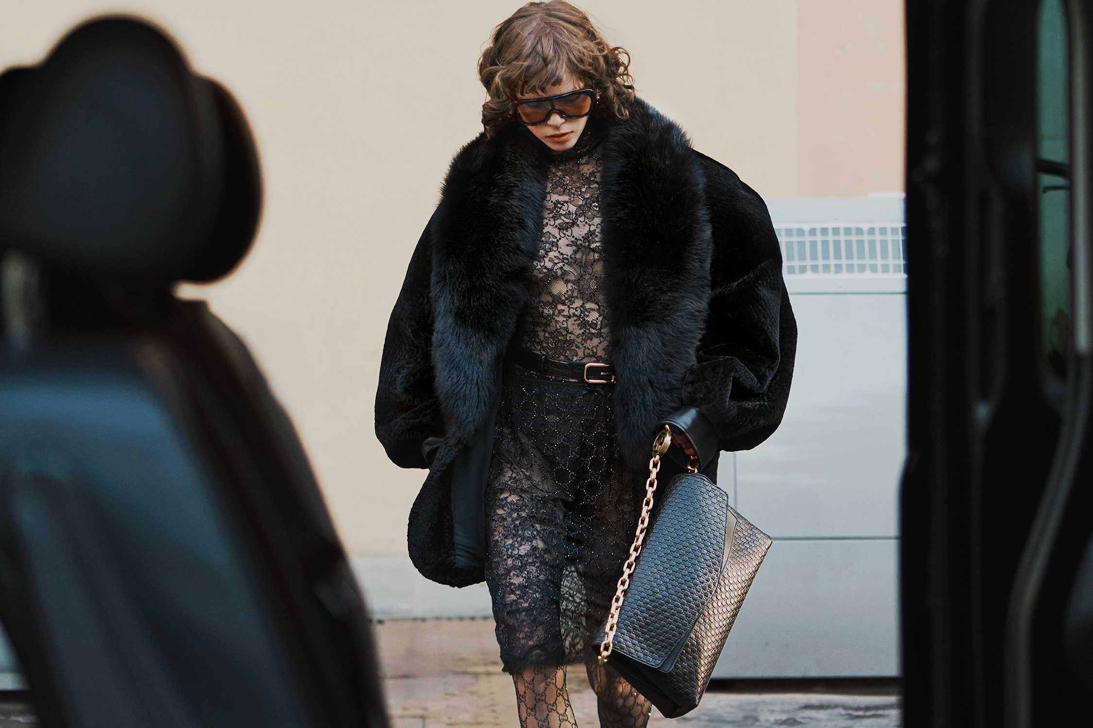 Black Gucci coat and bag