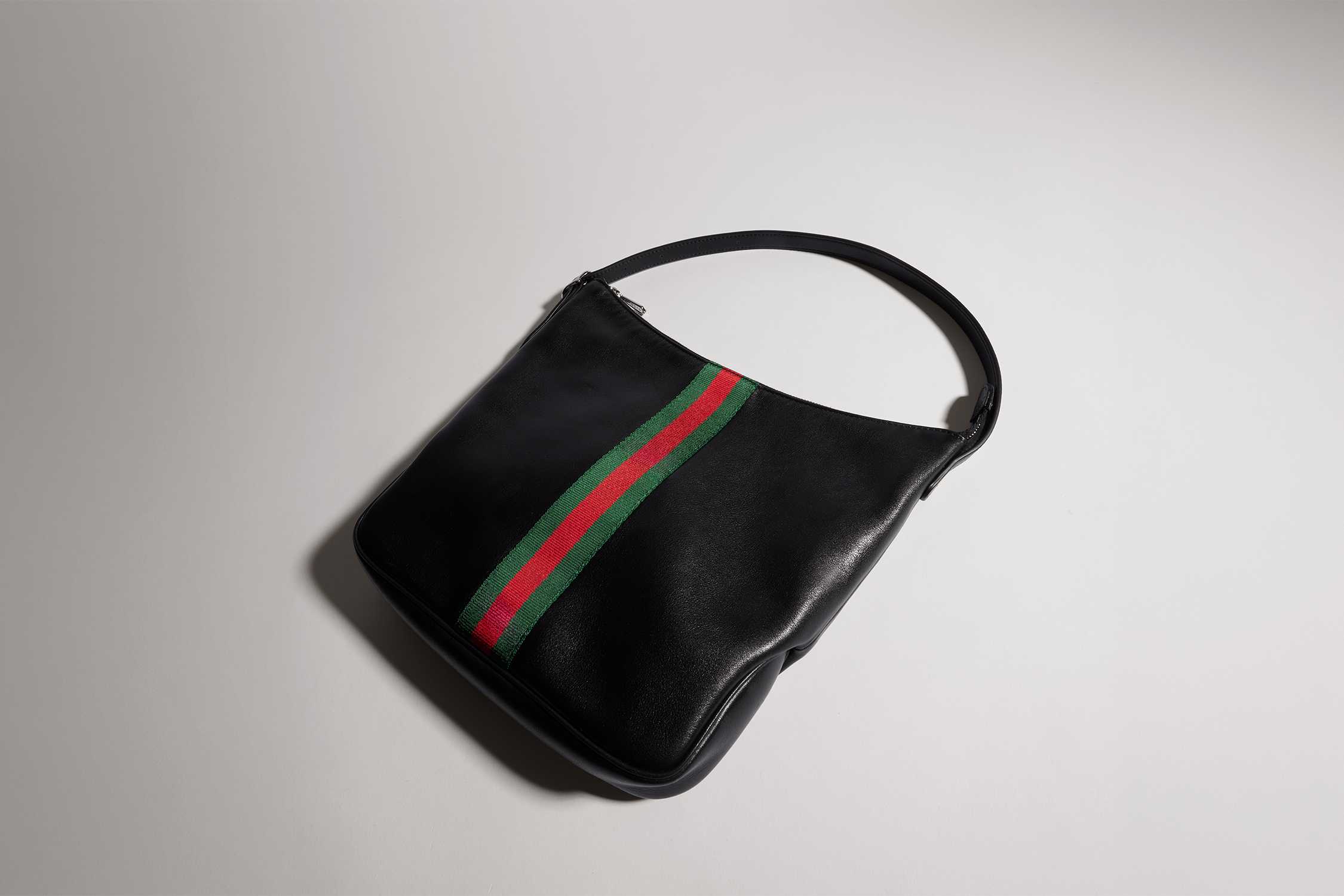 Black Gucci bag with green-red stripe