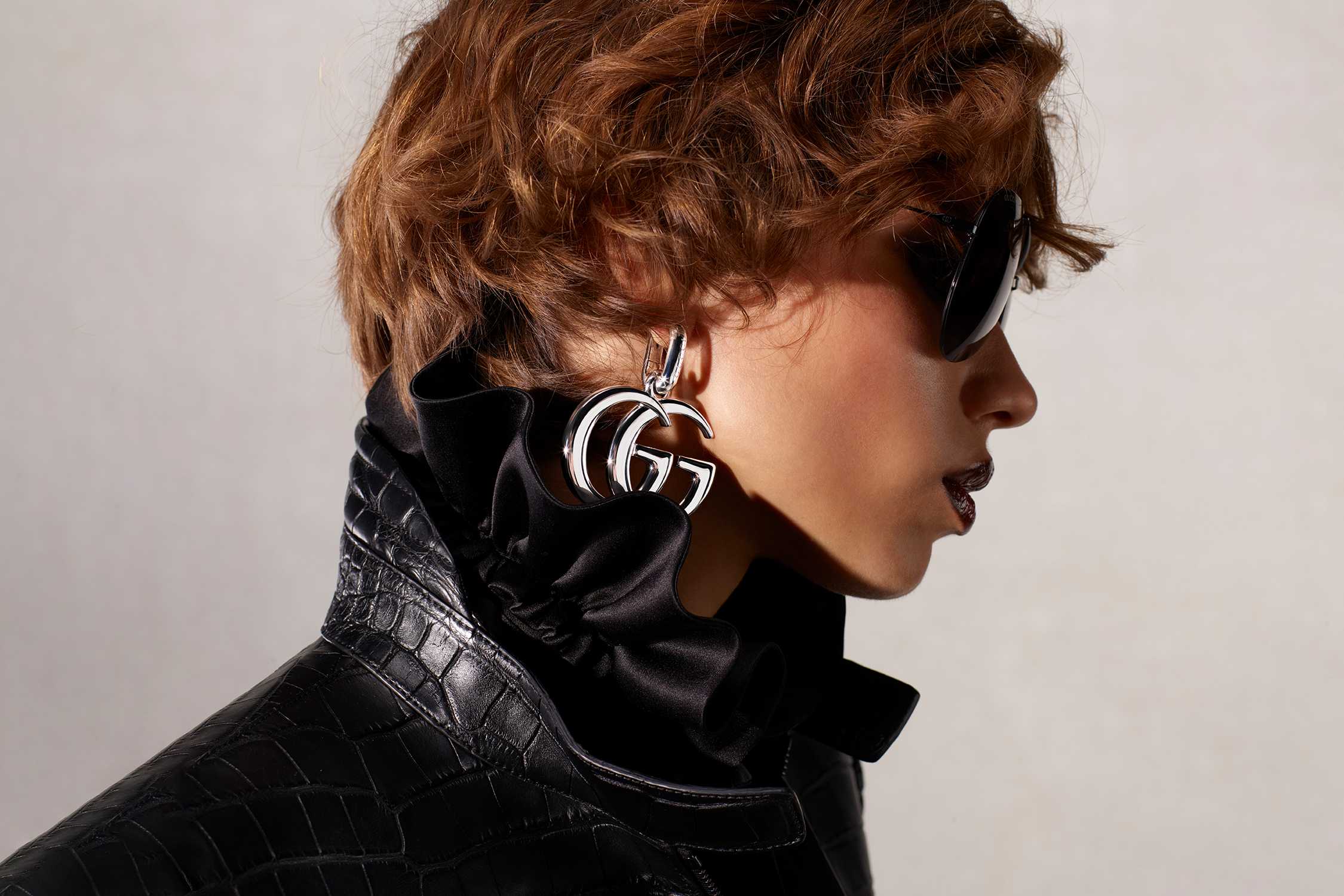 Silver Gucci earrings black sunglasses