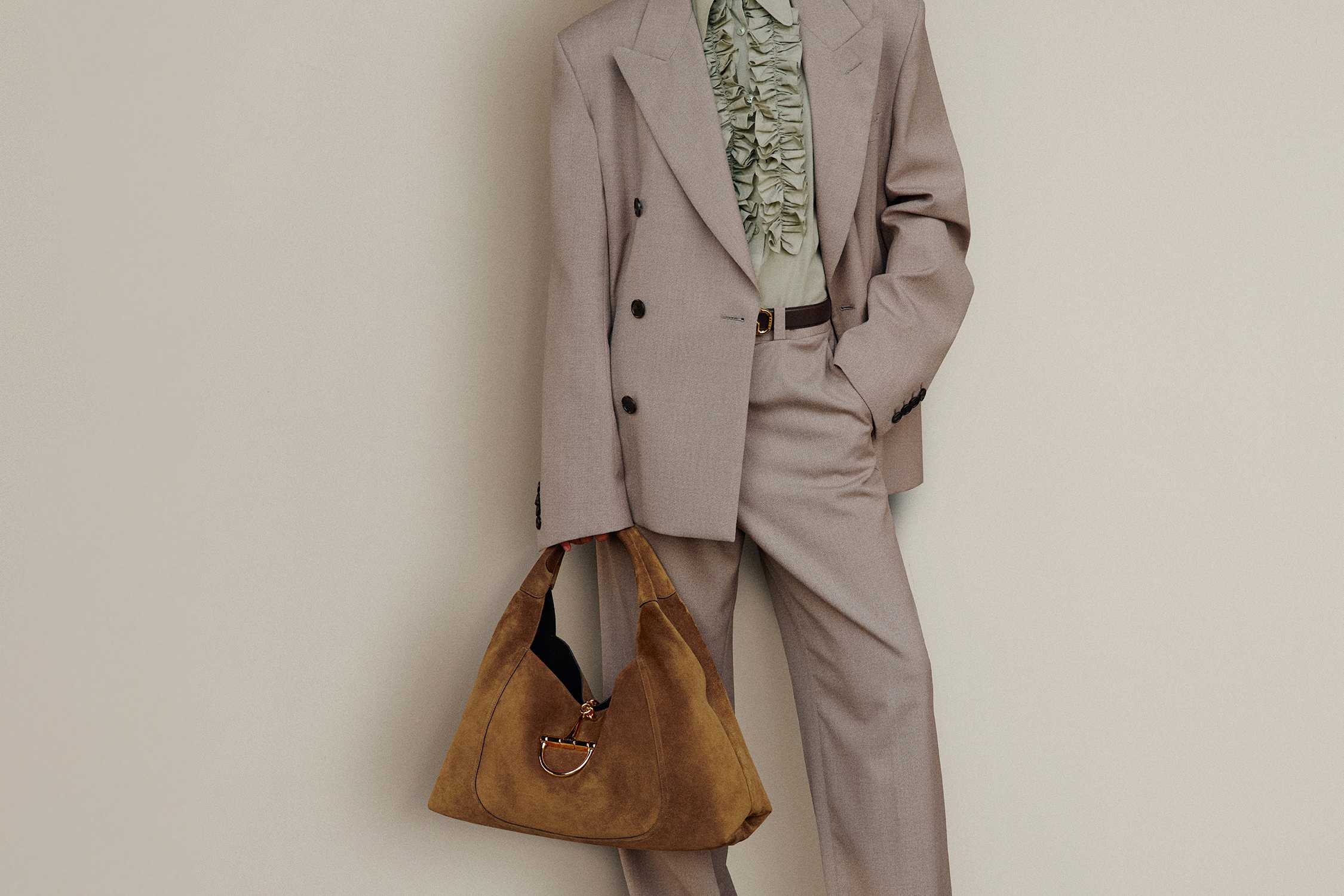 Beige suit with brown Gucci bag
