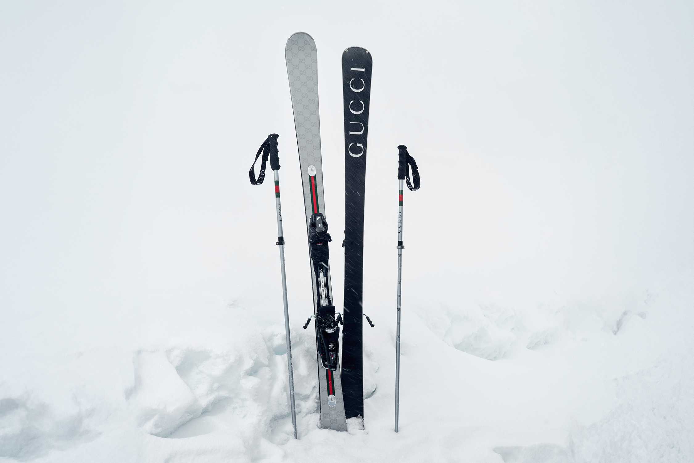 Black Gucci skis in snow