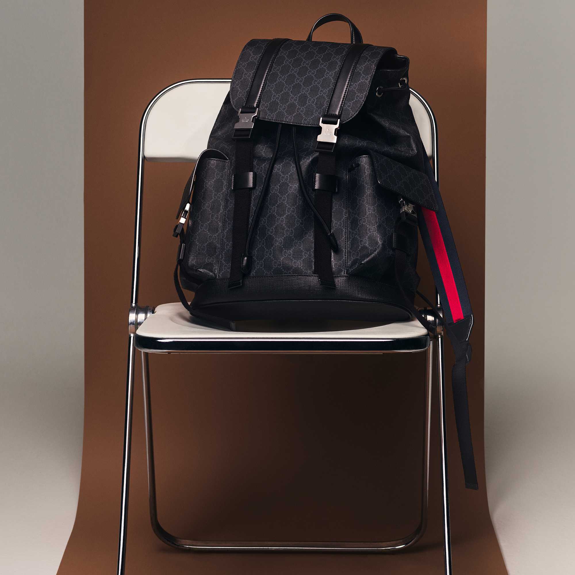 Black Gucci backpack with stripes