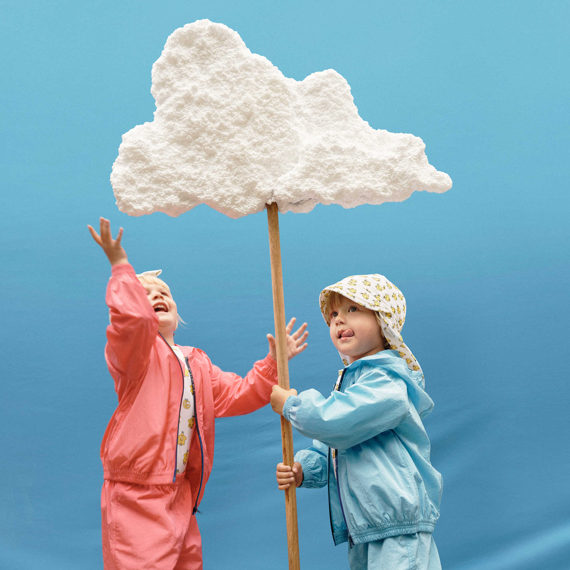 Children playing with a cloud