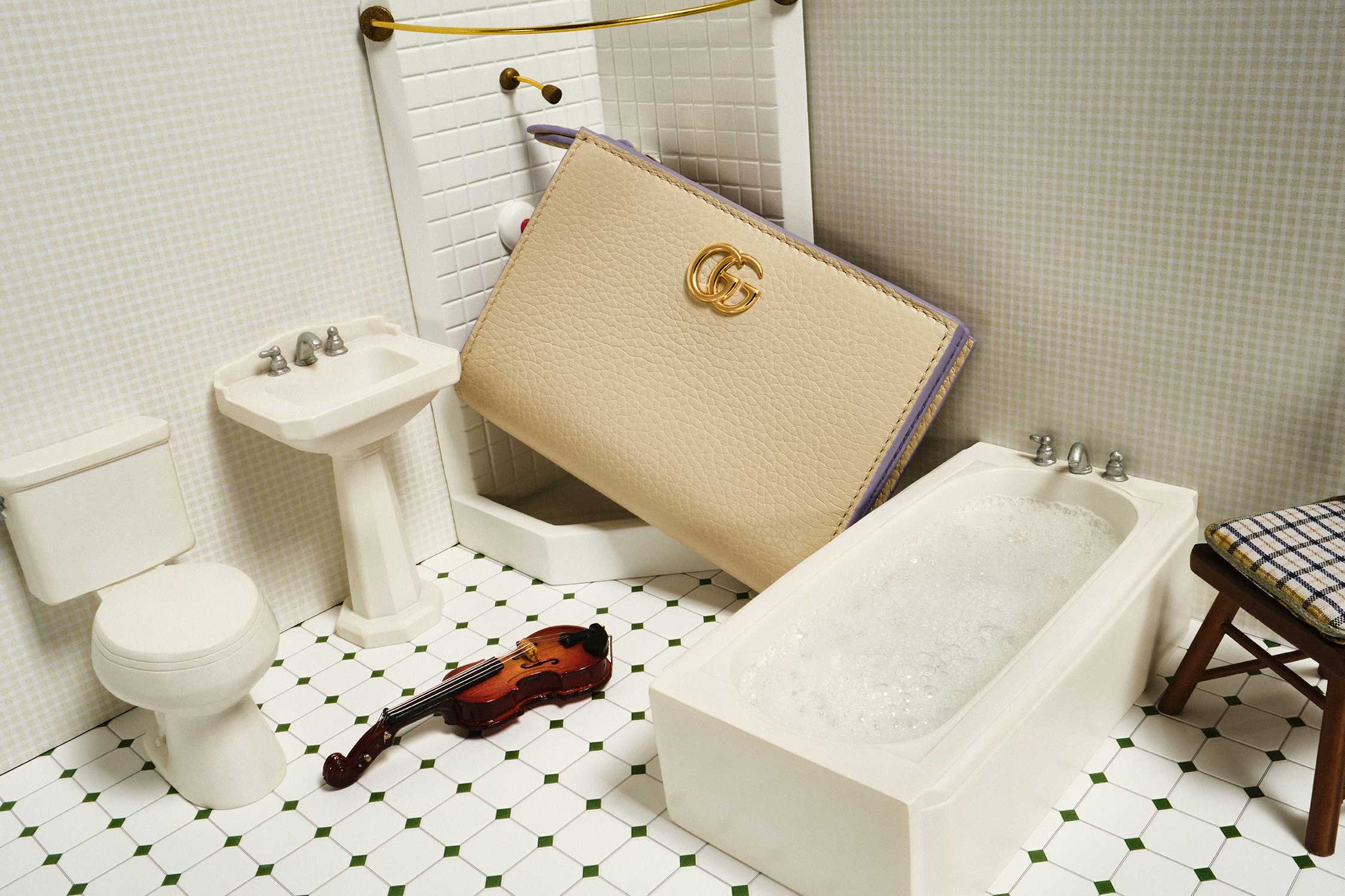 Beige Gucci purse in bathroom