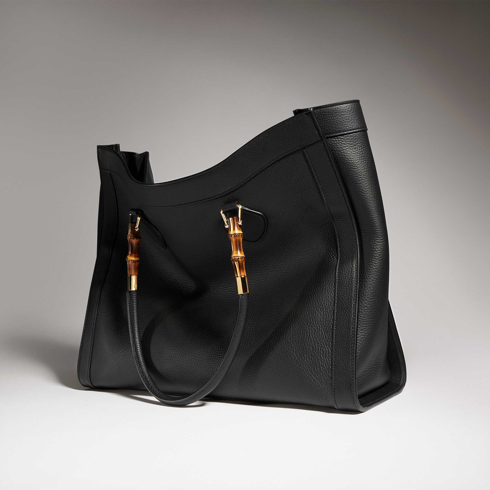 Black Gucci sunglasses and bag