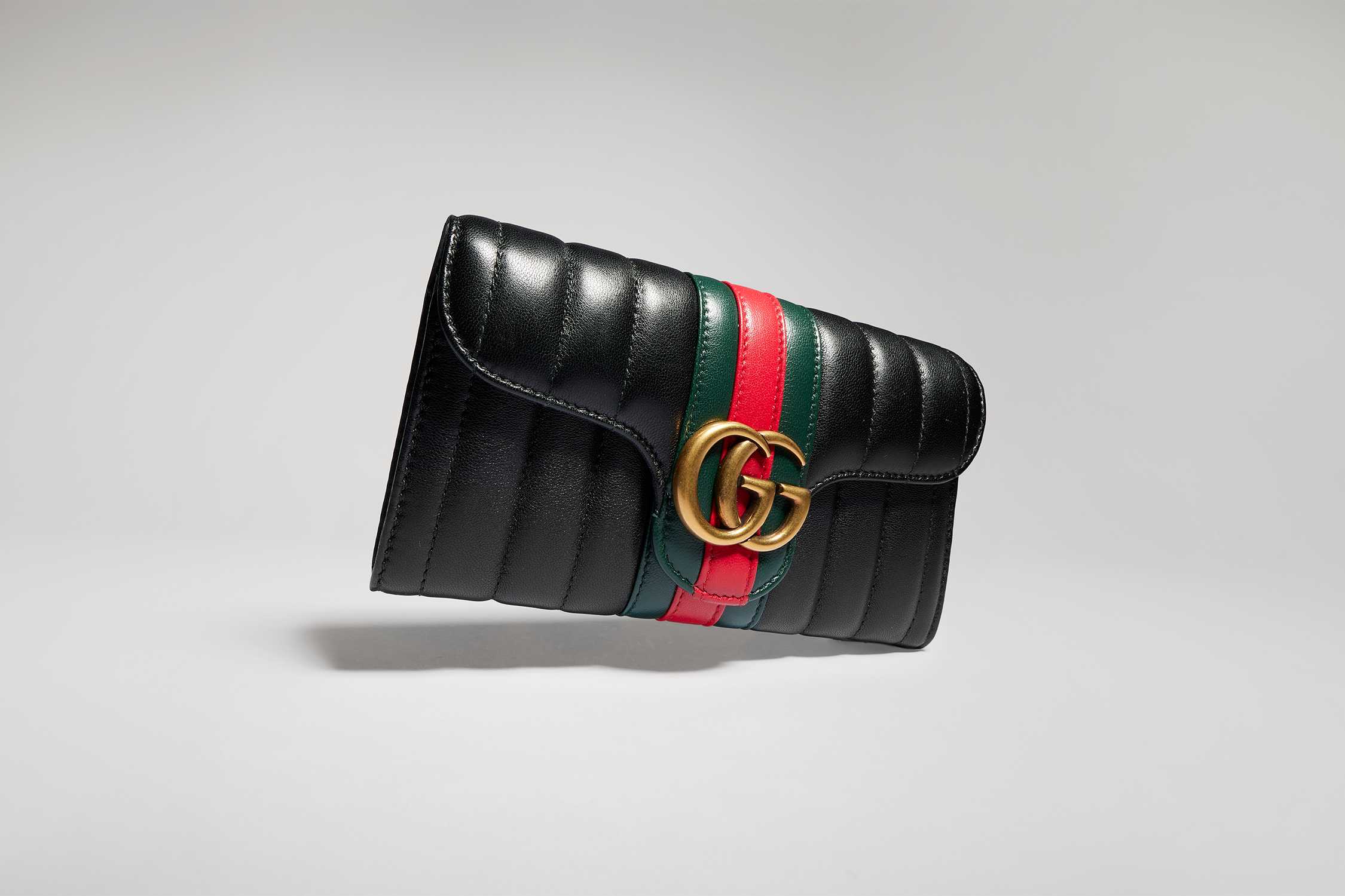 Black Gucci quilted clutch bag