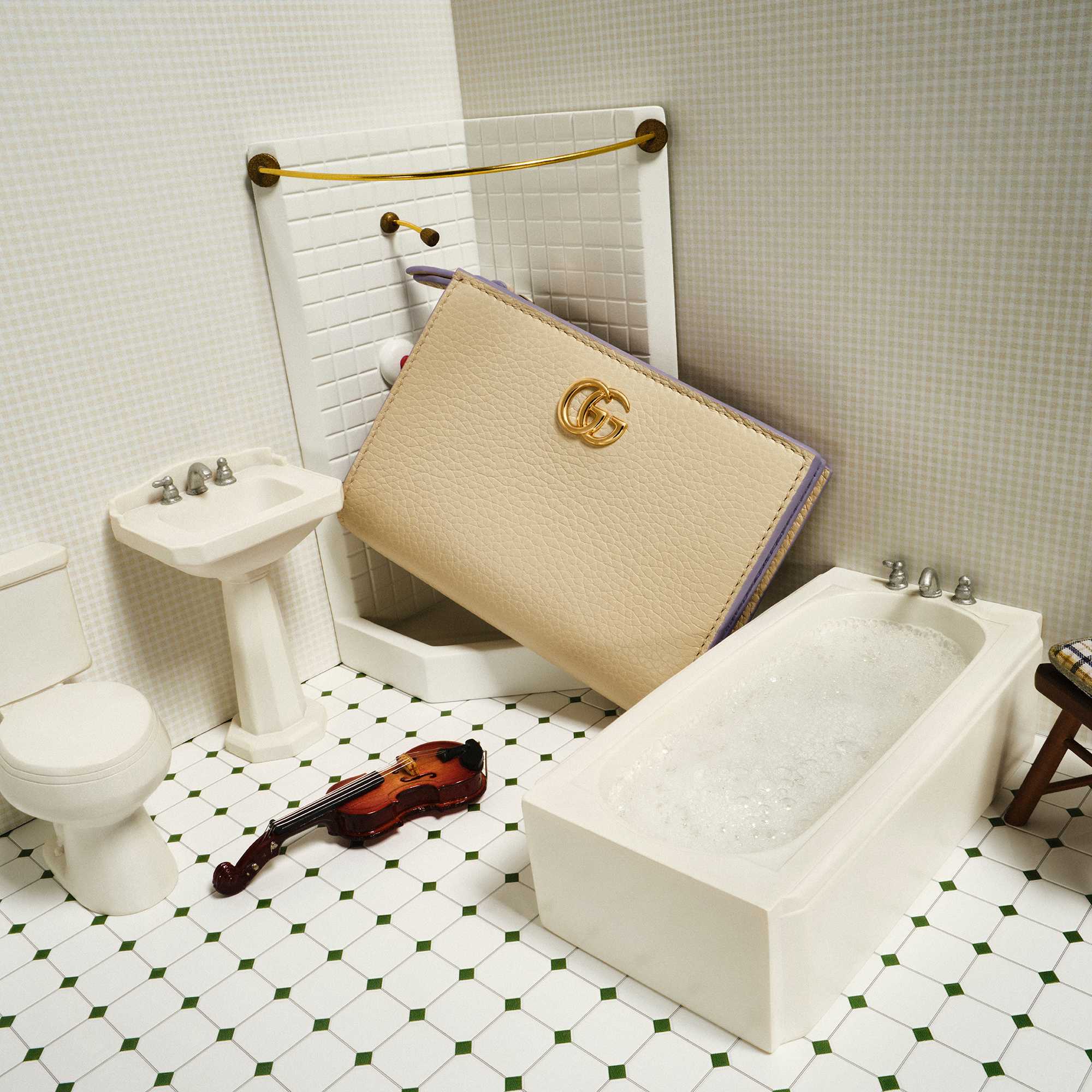Beige Gucci clutch in bathroom