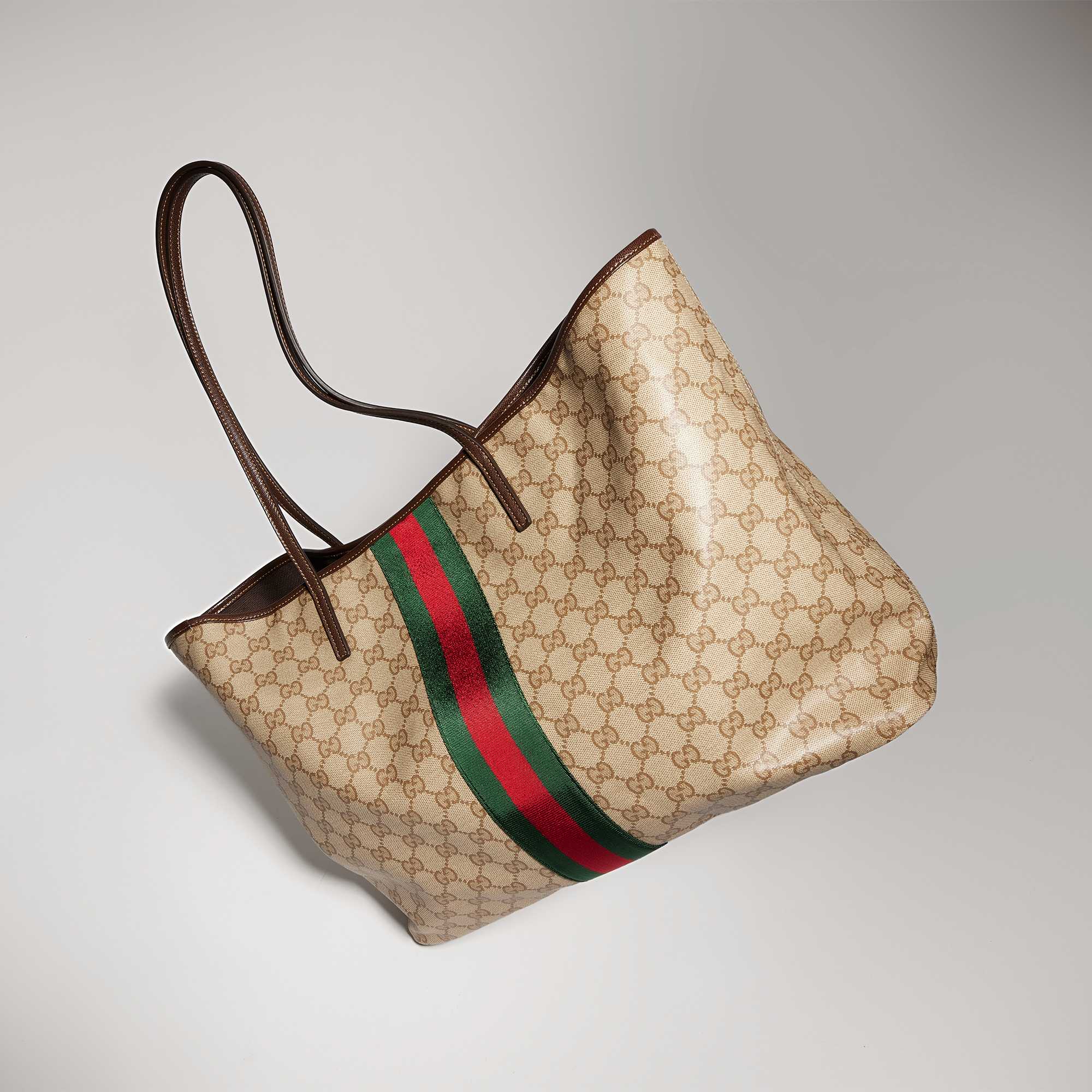 Beige Gucci tote with striped detail