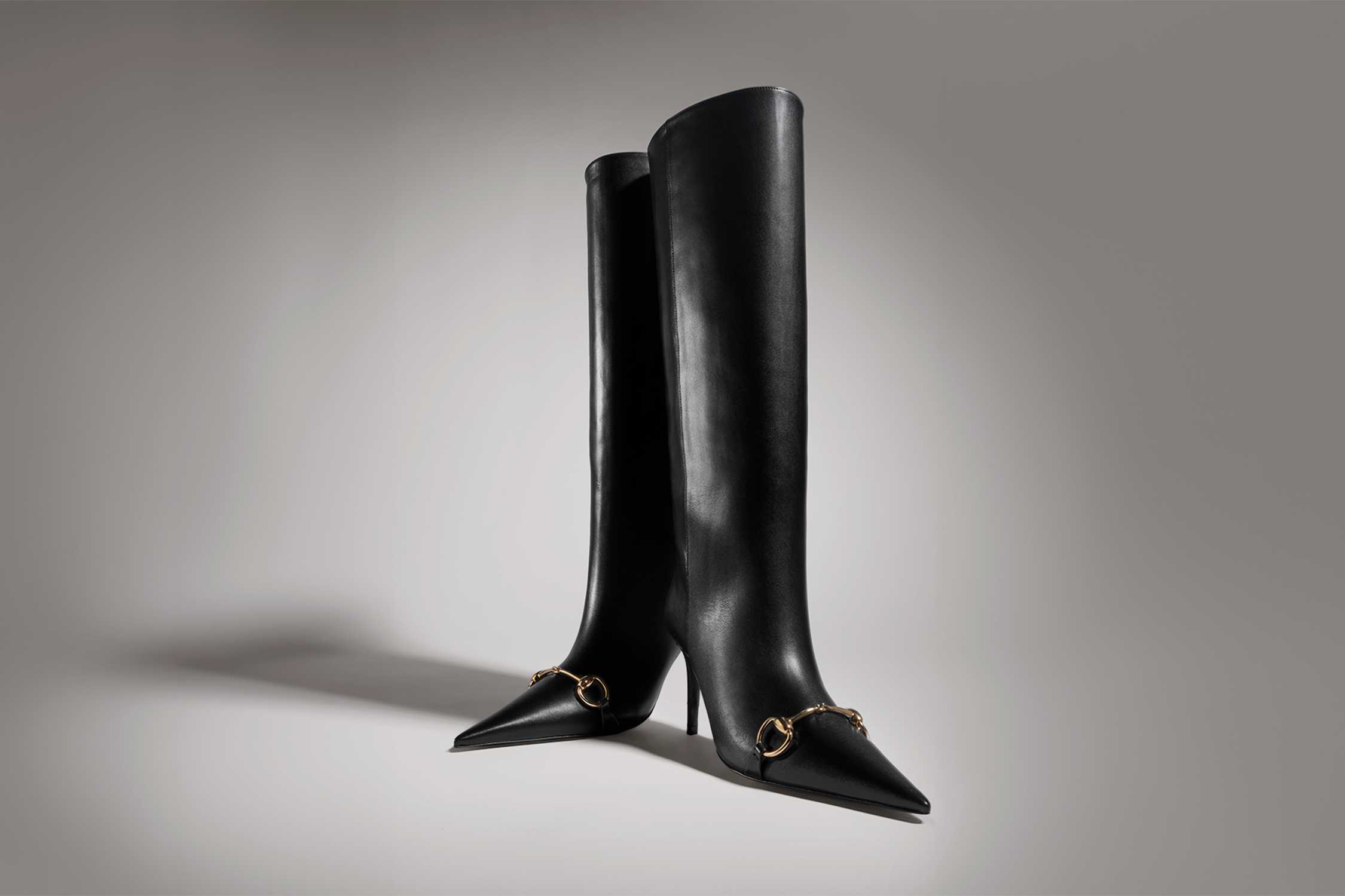 Black Gucci knee-high heeled boots