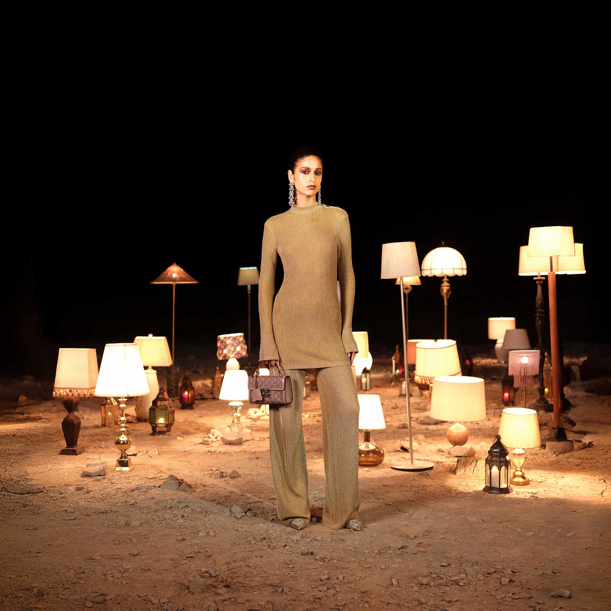 Beige Gucci outfit among lamps