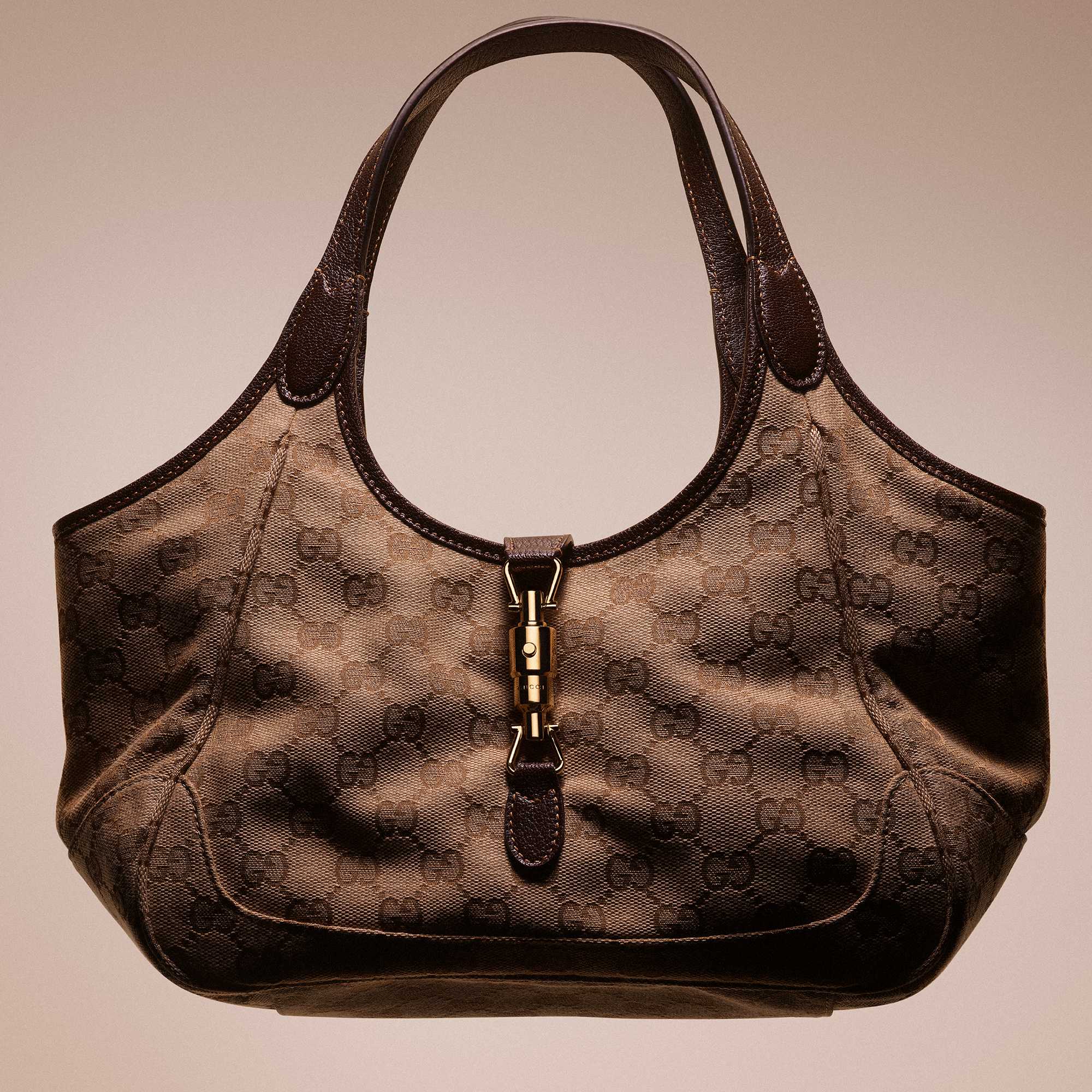 Black Gucci quilted handbag featured.