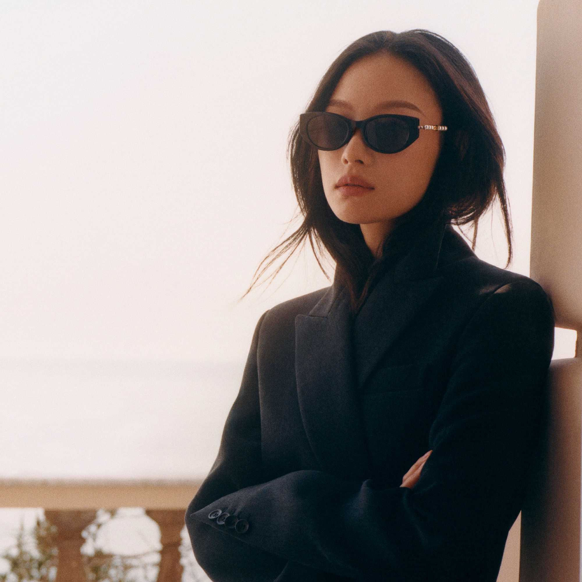 Black Gucci sunglasses and blazer