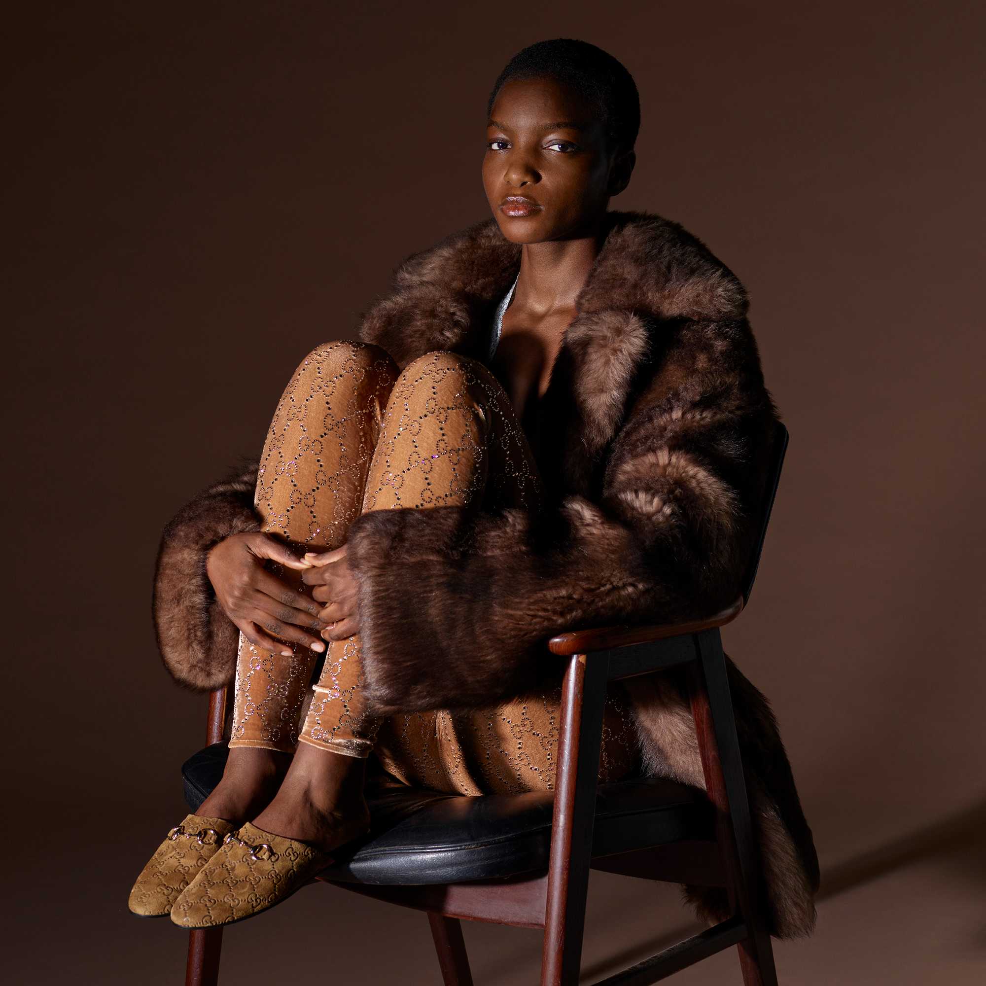 Black Gucci loafers in wardrobe