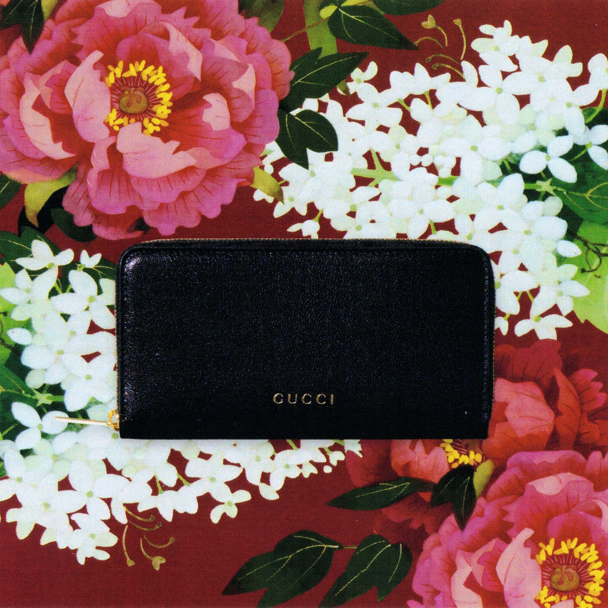 Black Gucci leather zip wallet
