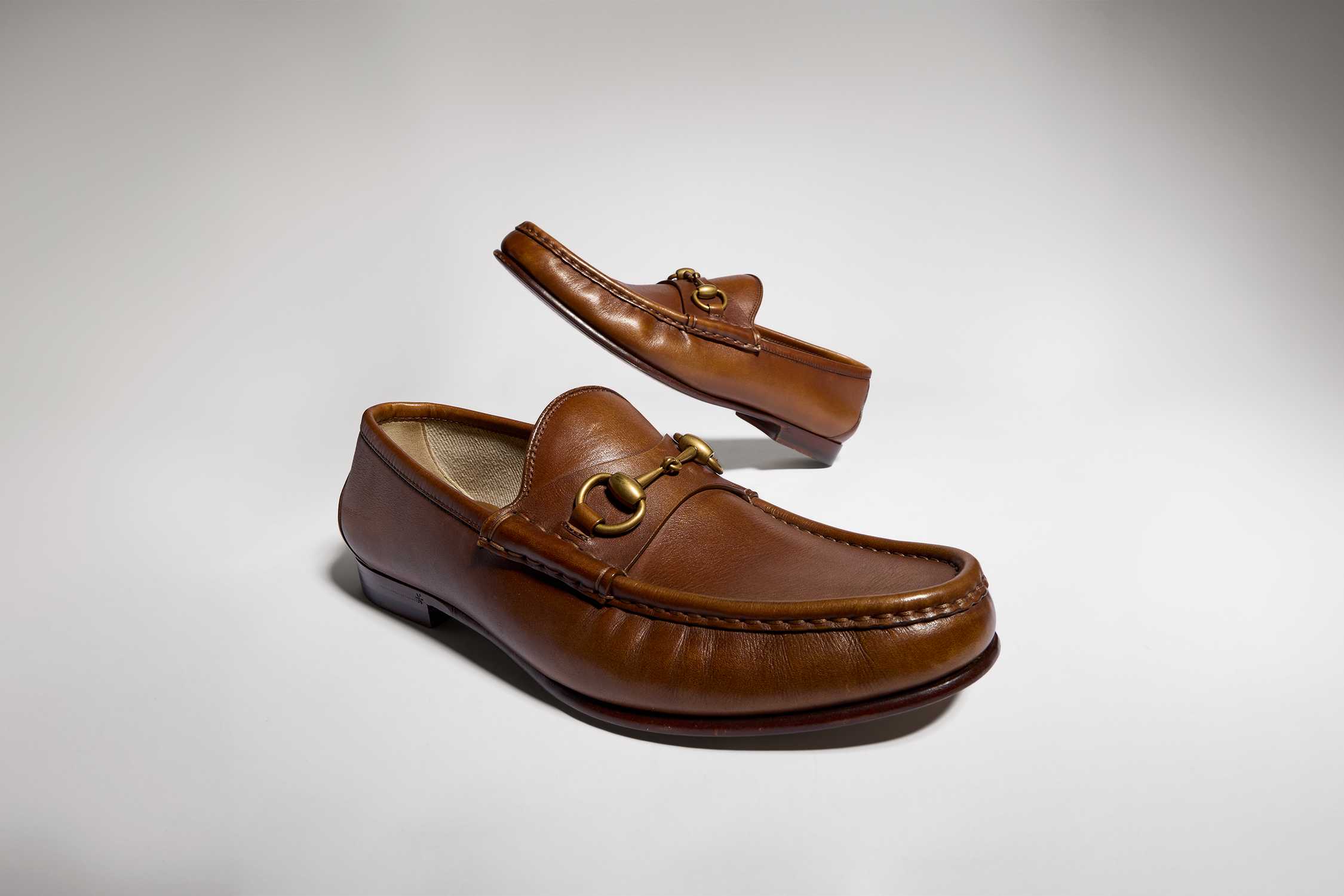 Tan Gucci leather horsebit loafers