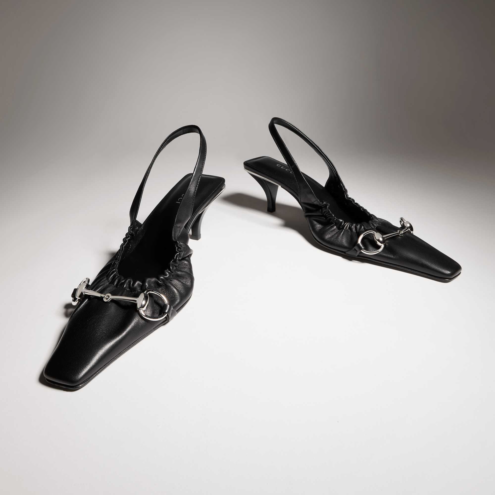 Black Gucci loafers in wardrobe