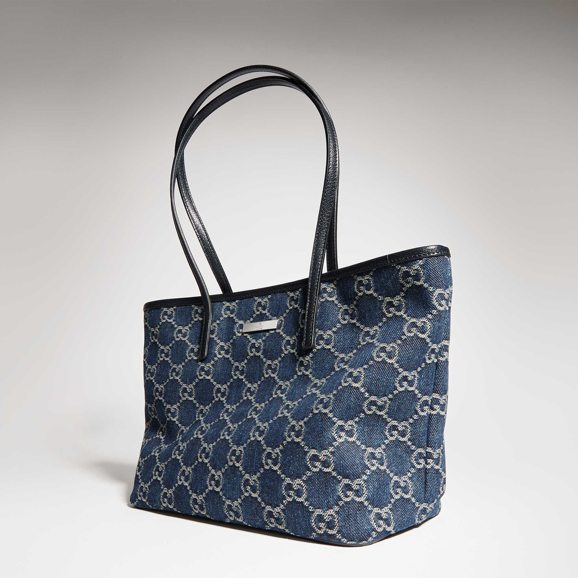 Black Gucci quilted handbag displayed.