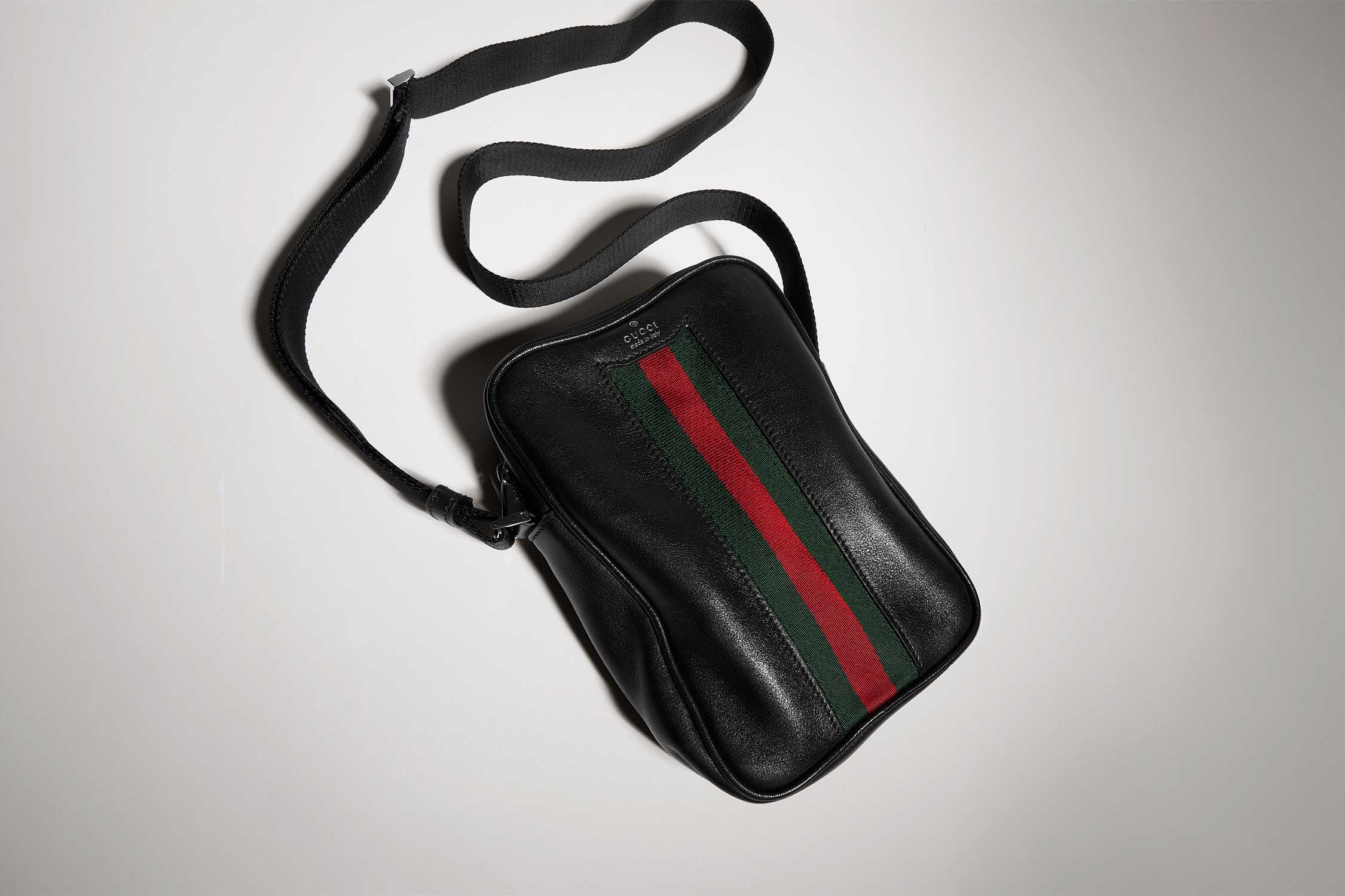 Black Gucci crossbody with stripes