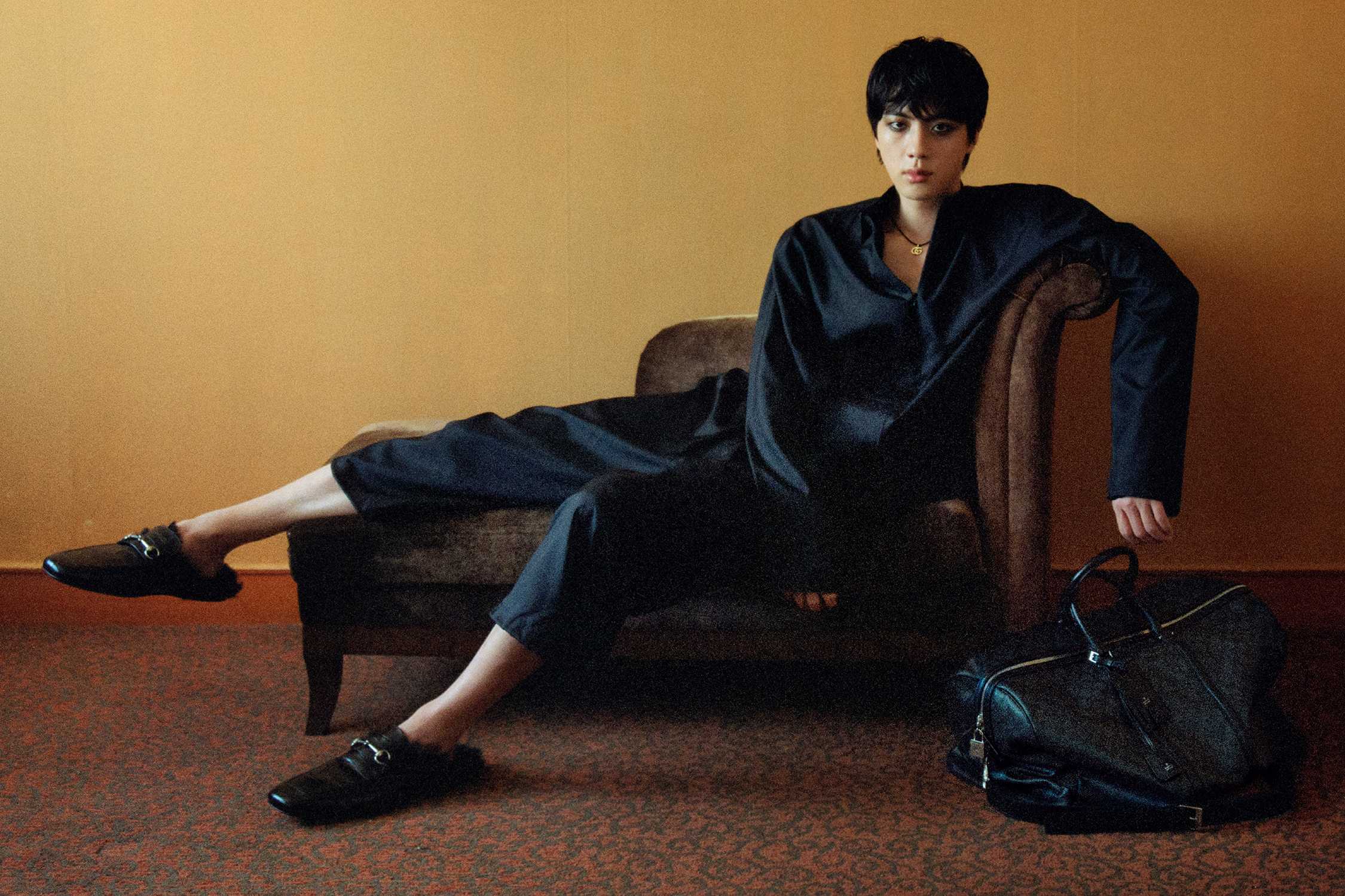 Black Gucci loafers and bag