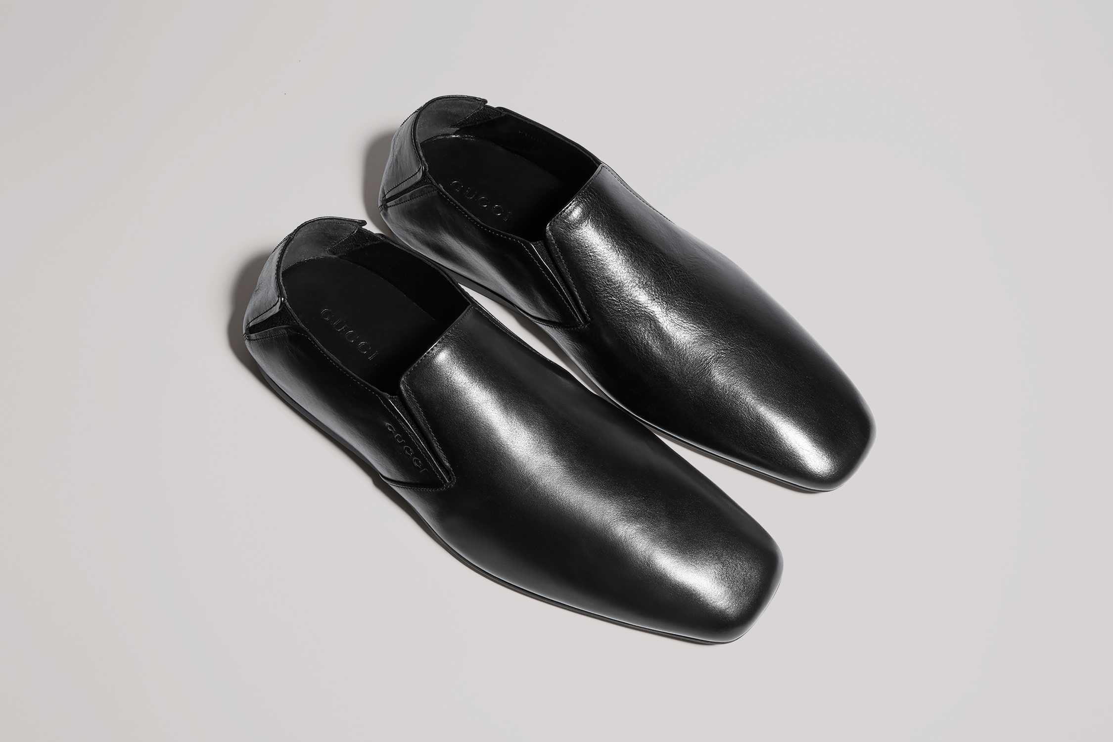 Black Gucci leather loafers pair