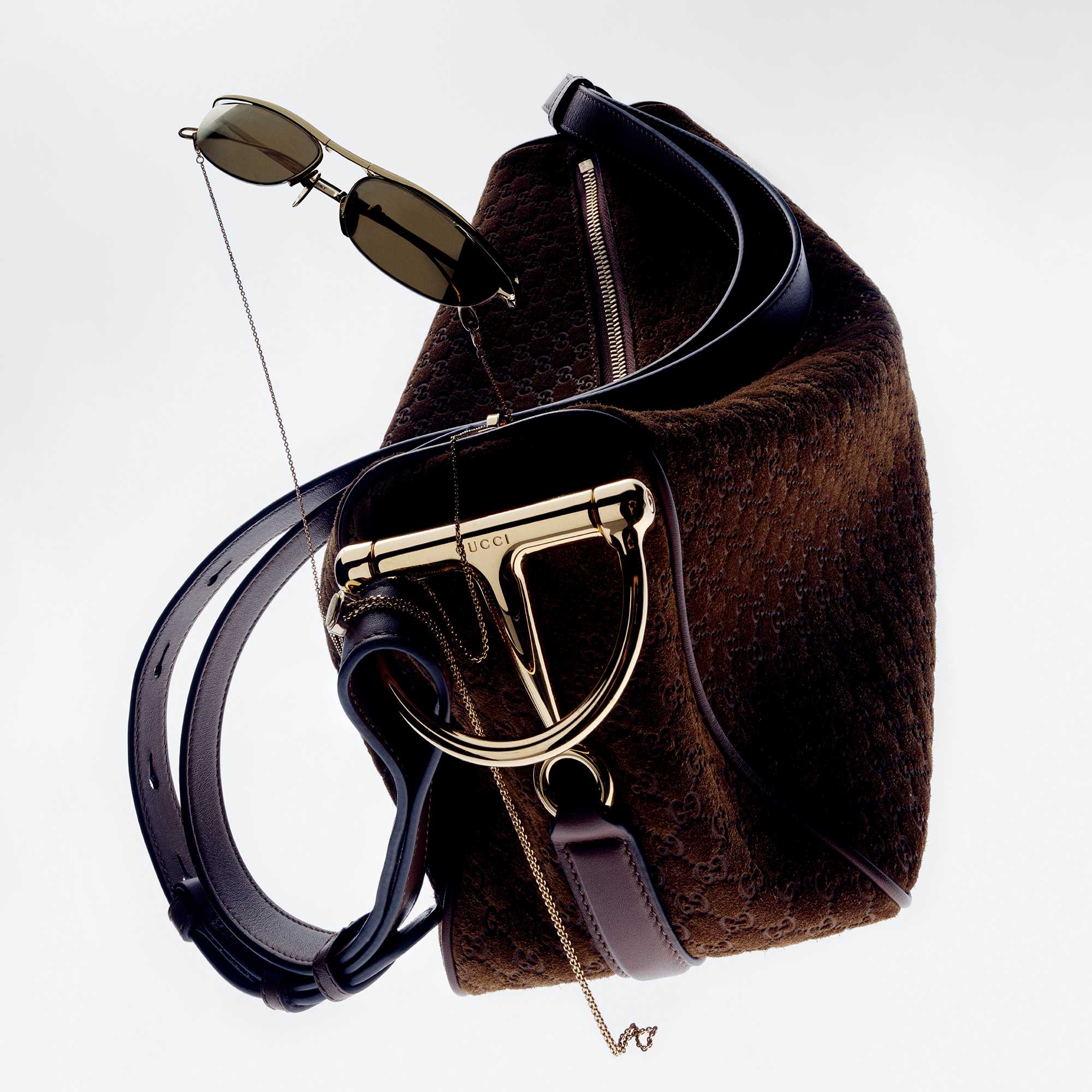 Green Gucci outfit, black bag.