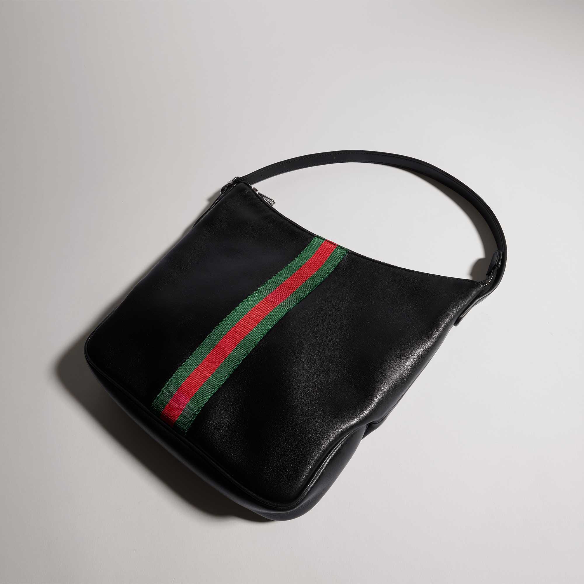 Black Gucci handbag with stripes