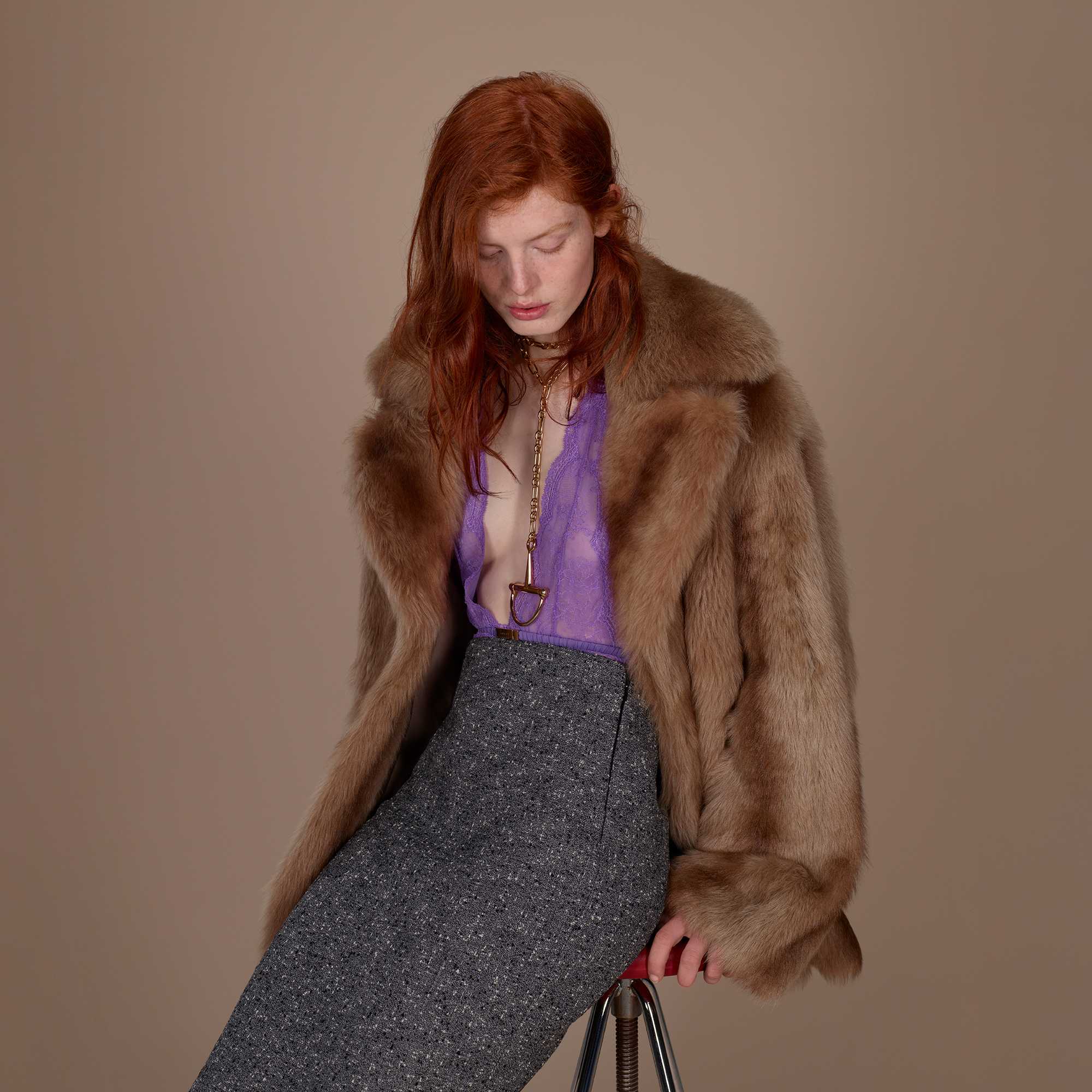 Brown fur coat, purple blouse