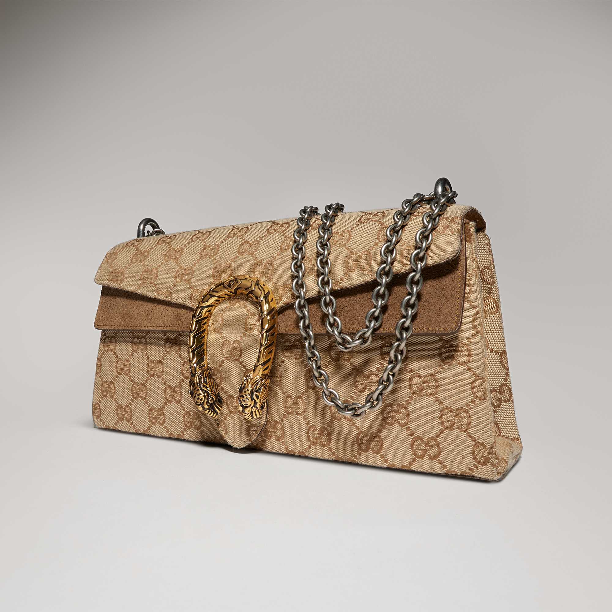 Brown Gucci bag with stripes.