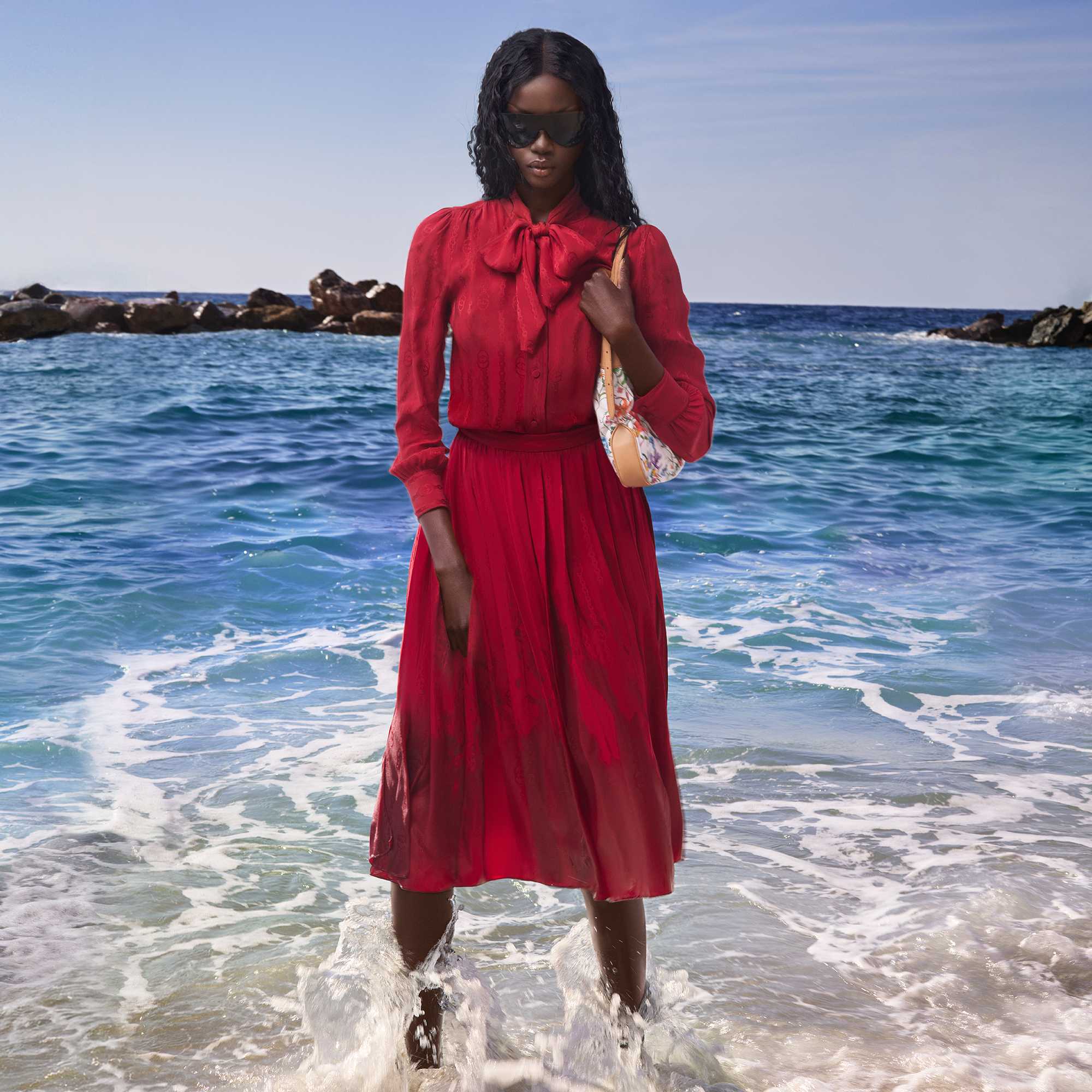 Red skirt set with Flora shoulder bag